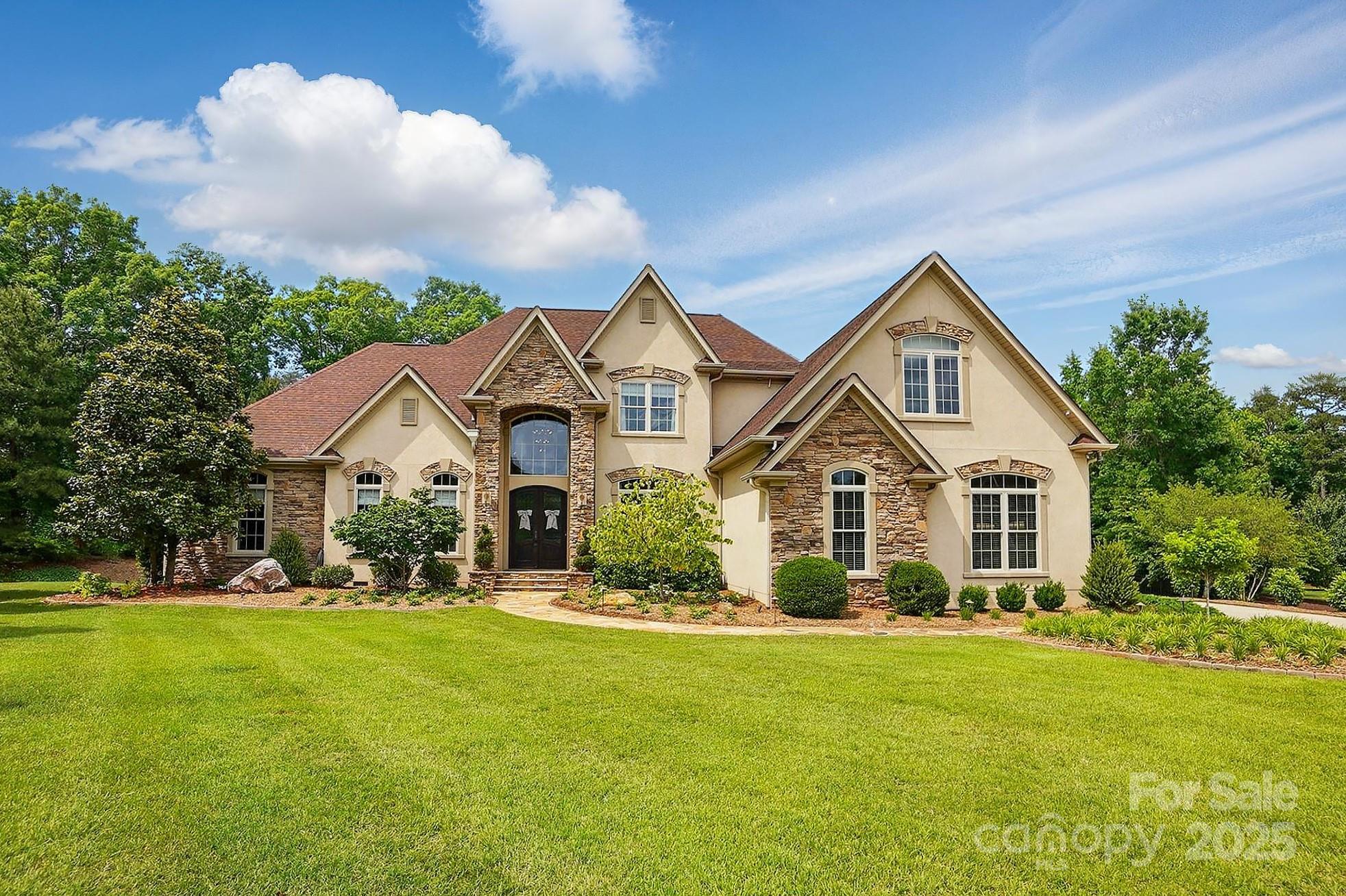 Located in the highly sought-after Eppington South community of Fort Mill, this 4,567 sq ft custom-built home is a rare gem set on a 1.30 acre cul-de-sac lot. With 4 bedrooms, 4.5 bathrooms, and a spacious bonus room complete with a wet bar, the home is thoughtfully designed for both luxury living and entertaining. Step outside to a resort-style backyard featuring a heated saltwater pool and a fully equipped pool house with a bathroom, sink, dishwasher, and full size pantry. A beautiful screened porch with gas logs offers year-round comfort for outdoor living. Inside, custom finishes and impeccable built-ins showcase craftsmanship and attention to detail throughout. Additional highlights include light-filled windows, gas logs in the study/office, generator, central vacuum, irrigation, professionally landscaped grounds, and an oversized garage. This exceptional home offers a seamless blend of refined interiors and resort-style amenities combining comfort, elegance, and functionality.