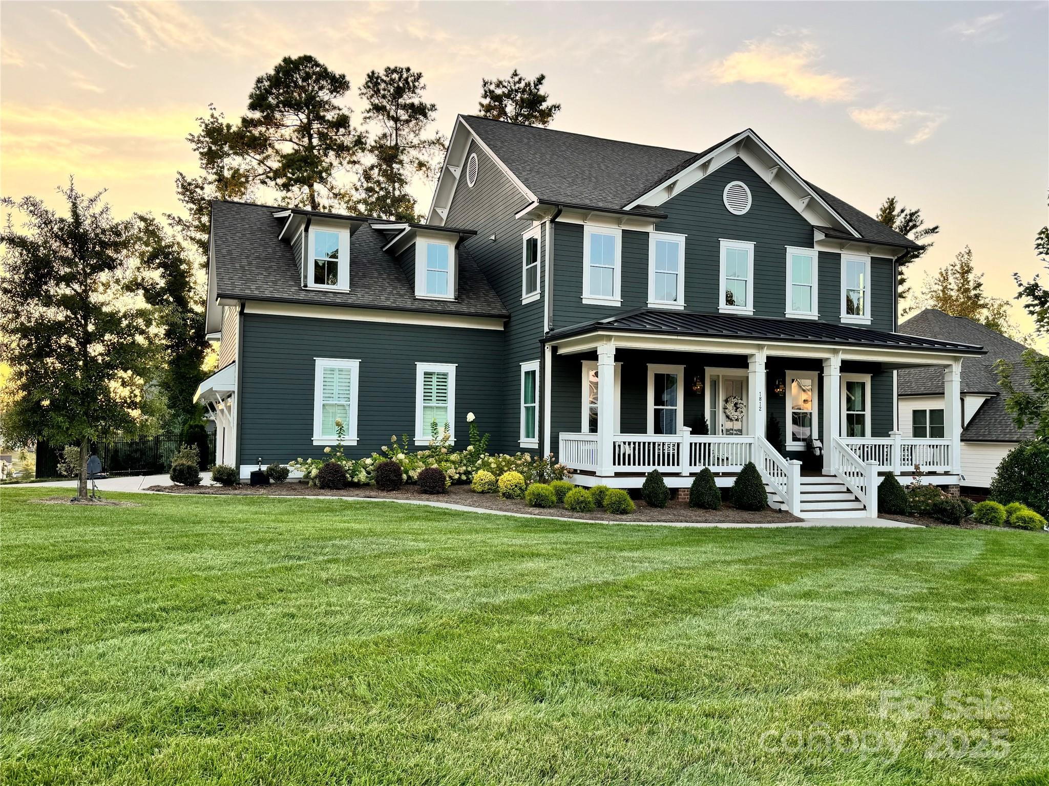 Immaculate inside and out, w/ all the custom upgrades and finishes built by luxury builder Saussy Burbank. 3 car side load garage on large fenced corner lot surrounded by mature trees for privacy. No details missed! Real hardwoods custom stained on entire first floor, stairs, upstairs hall, primary, and bonus room. Stunning built in cabinetry and moulding throughout, Custom drop zone cabinet lockers, wooden beams, shiplap, and brick mantle. Upscale kitchen w/ waterfall quartz island, brushed gold finishes,  farmhouse sink, GE monogram appliances/gas range, stacked cabinets,chimney hood. Custom Motorized shades and plantation shutters. Enjoy sunsets and sunrise on oversized front porch or back Screened porch.  Garage equipped with custom storage and built ins. Whole home water filter and tankless water heater.  Walk in crawl space for additional storage. Irrigation system in front & backyard. Prime location in Fort Mill & a close walk to state of the art Catawba Ridge High school.