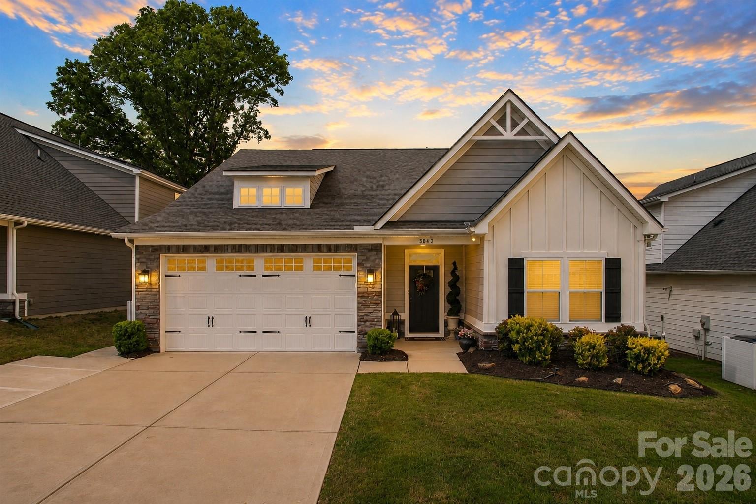 This beautifully designed newer home is located in a 55+ community. Offering 4 bedrooms and 3 full baths, this home blends modern comfort with thoughtful design, perfect for both everyday living and entertaining. The open-concept floorplan welcomes you with natural light and seamless flow between the living, dining, and kitchen areas. At the heart of the home, an oversized island anchors the kitchen, complemented by stainless steel appliances, ample cabinetry, and stylish finishes. 
The living room is highlighted by a dramatic floor-to-ceiling stone gas fireplace that creates a warm and sophisticated focal point. Step outside to enjoy the screened-in porch or host gatherings on the expansive stamped concrete patio. The spacious bedrooms provide flexibility for guests, hobbies, or a home office, while the main floor primary suite offers comfort and privacy. Home also features a tankless water heater and added electrical panel allowing you to hook up a generator if power is lost.  Beyond the home, amenities including a community pool and maintenance-free lawn care covered by the HOA. This home delivers the perfect balance of style, comfort, and low-maintenance living-don’t miss your opportunity to make it yours.