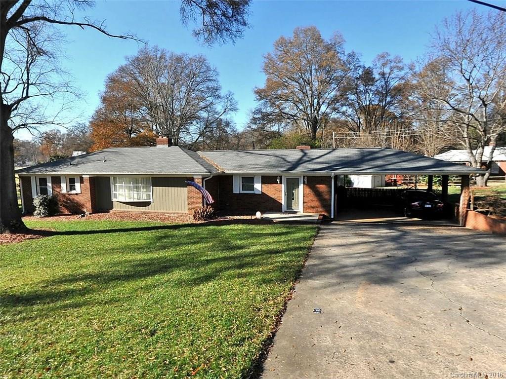 One level living at its BEST. Over 2200 sq feet. Solid all brick totally updated home in a great LOCATION.  Extra Large Family Room with fireplace. Formal Living w/fp and Formal Dining.  Modern Kitchen with plenty of cabinetry and breakfast bar. Sizable bedrooms. Owner Suite with an updated bath. Bedroom 2 has its own 1/2 Bath. Hardwoods throughout. Sun-porch and covered patio! Beautifully fenced backyard. Great for outdoor entertainment.