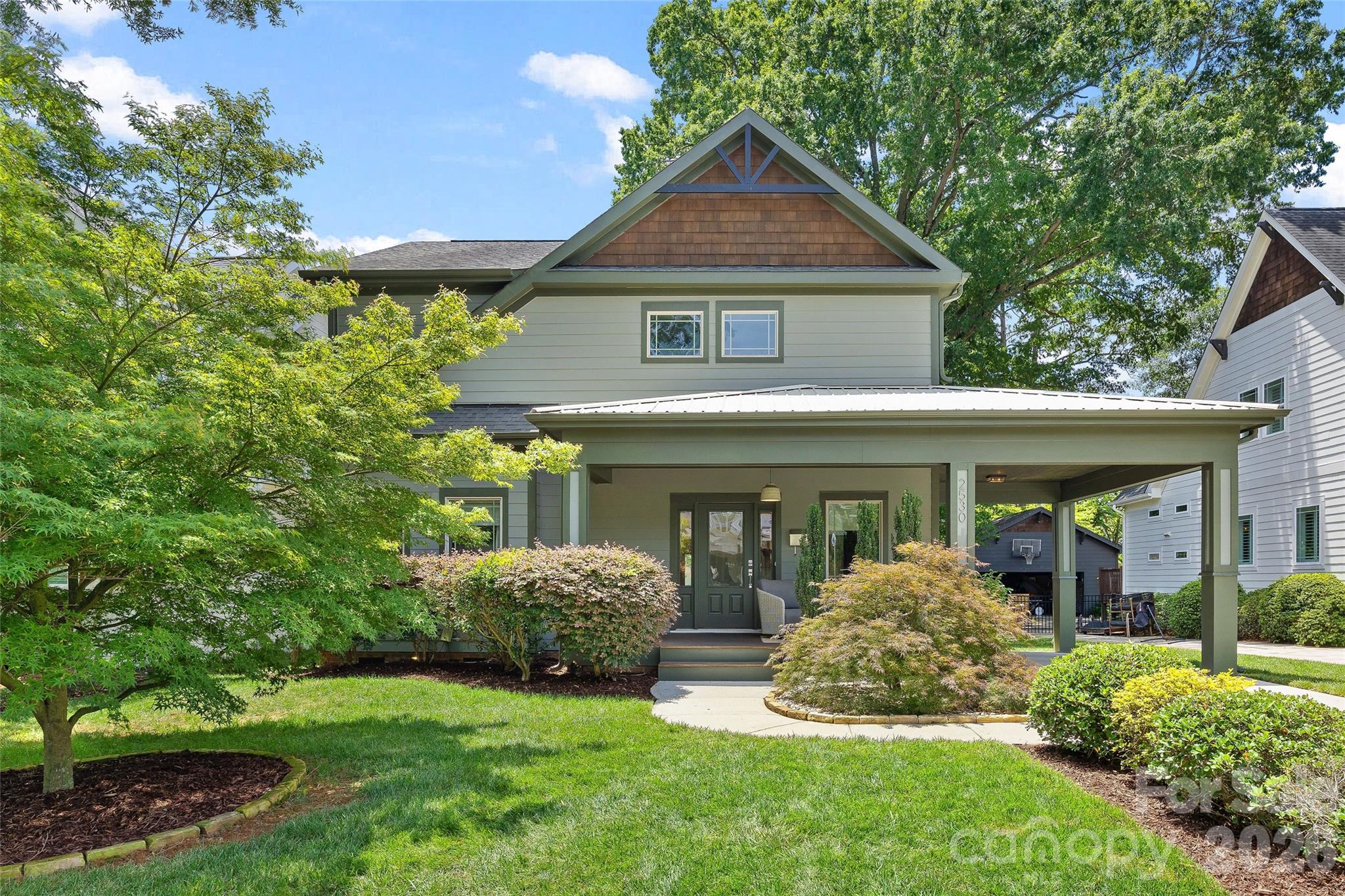 Nestled on idyllic Bay Street in the sought-after Chantilly neighborhood, this charming home offers a thoughtful layout and timeless features throughout. The main level includes a spacious primary suite with a full bath and oversized closet, beautiful hardwood floors throughout the entire level, and a soaring cathedral ceiling in the living room that adds warmth and dimension to the space. The open-concept living-kitchen-dining spaces flow seamlessly through double french doors to the outdoor living area. This home has tons of storage throughout. Upstairs, three generously sized bedrooms and a full bath, as well as an oversized landing giving flex space, provide tons of space for guests, office space, or everyday living. A convenient carport offers coveted covered parking and adds to the home’s curb appeal. And don't miss the fenced-in and flat backyard just waiting to be personalized.  Easy access to Plaza Midwood, Elizabeth, Uptown, and more!