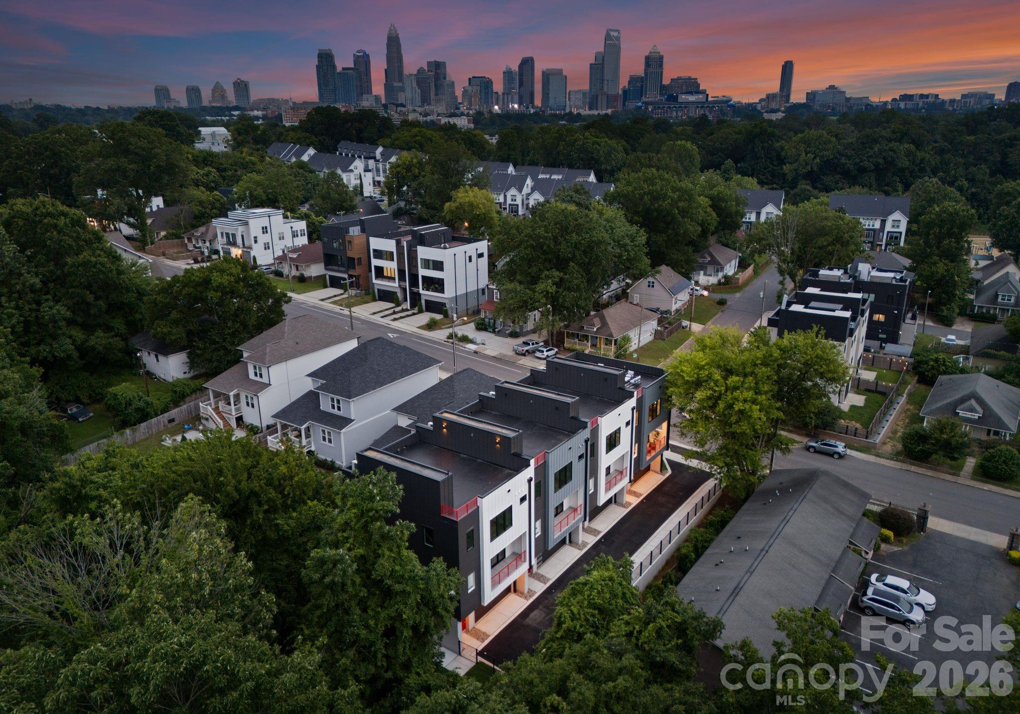 Last opportunity to own one of the State Street Four! Brand new townhome in the booming neighborhood of Seversville. Steps away from the Stewart Creek Greenway & Savona Mill, this home offers a single family feel and direct access into Uptown Charlotte, Southend & is 10 minutes from Charlotte Douglas International Airport. This home features engineered hardwoods throughout with designer tile in all bathrooms, 36" gas cooktop with Zephyr range hood, built-in wall oven/microwave, stainless steel appliances, walk-in pantry, electric fireplace, main level balcony, downstairs kitchenette/wet bar with second laundry hook-up, oversized walk-in closets for primary & guest bedroom, primary bath soaking tub & rainfall shower, floating shelves & an electric fireplace. These units have an energy efficient HVAC with whole-home dehumidifiers. The rooftop terrace is over 900 square feet of an entertainers dream: wired for a hot hub, plumbed for an outdoor kitchen & includes a gas line. Schedule your tour today in one of the fastest growing neighborhoods in Charlotte!