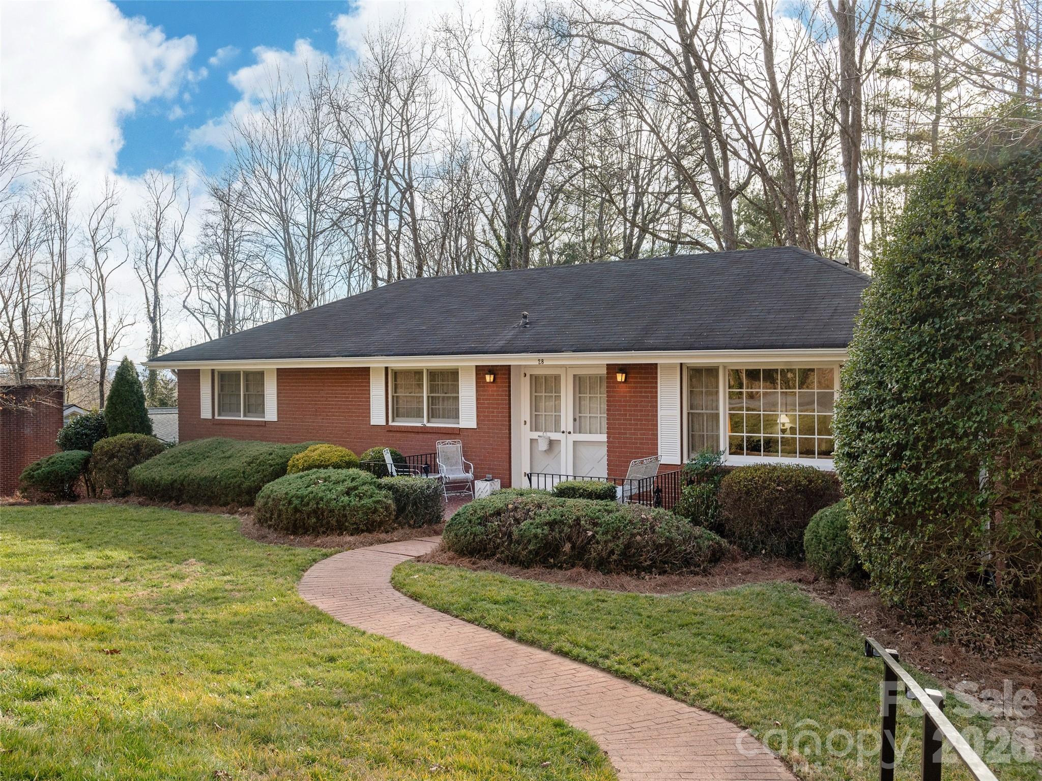 Built in 1961, this solid brick ranch is ideally located in Oak Forest—one of Asheville’s original early1960s neighborhoods. Lovingly cared for by one family since it was built, this home is ready for your remodeling vision. Create your ideal space within a traditional floor plan featuring 3 bedrooms and 2 bathrooms for easy one-level living. The basement offers a spacious family room for gatherings, plus a two-car garage. Enjoy mature landscaping and a shaded, gently sloping backyard, with green space and a park just across the street. Convenient to all South Asheville amenities—shopping, dining, and schools—this property offers both charm and opportunity. Whether you preserve its vintage character or bring a fresh, modern transformation, this is the perfect canvas to make your next home.