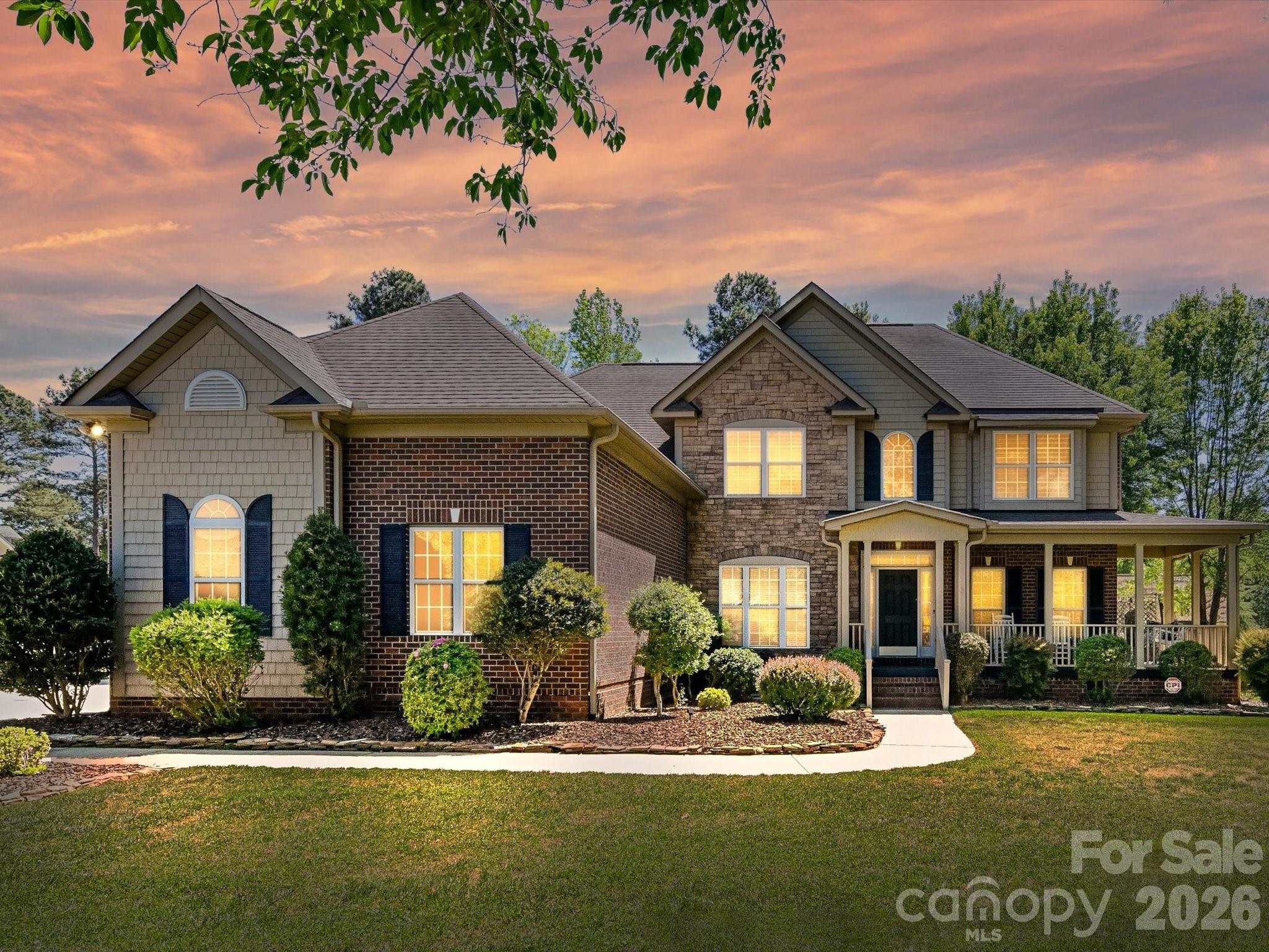 Arrive Home to your Peaceful and Serene Surroundings close to Lake Wylie! Wonderful Curb appeal enhances this lovely home on over 1 acre lot. CAR ENTHUSIASTS will LOVE all the SECOND GARAGE! Home has Attached Three Car Garage PLUS SECOND GARAGE with 815 SF that can fit 2-4 more cars! MUST SEE! Relax in the Screened Porch that views Tall Mature Trees, Large Stamped Patio, Covered Trellis for your Swing, and Beautiful Landscaping! Fenced yard too! The interior has recently been painted. Two Story Foyer leads to Living and Dining Rm. Wood Flooring and Crown Moldings in most main level rooms. Dramatic Vaulted Great Room with Gas Fireplace and Custom Mantle. Open Concept from Kitchen to Great Room for ease of Entertaining. Kitchen Boasts of Glass Front Cabinet, Gas Range & Breakfast Bar. Primary Bedroom on Main w/Tray Ceiling, Corner Garden Tub and Separate walk in Tiled Shower. Staircase to Upper-Level boasts of Wood Treads & Iron Balusters. Enjoy all the Space offered on this level! Three additional Bedrooms, Two Full Baths, Flex Room and a Large Bonus Room/Media Rm and Multiple Walk-in Storage areas! Wonderful Schools & Low Taxes, Your Opportunity to own a full brick home, 5 car garage, and One Acre Lot close to the Lake Wylie!