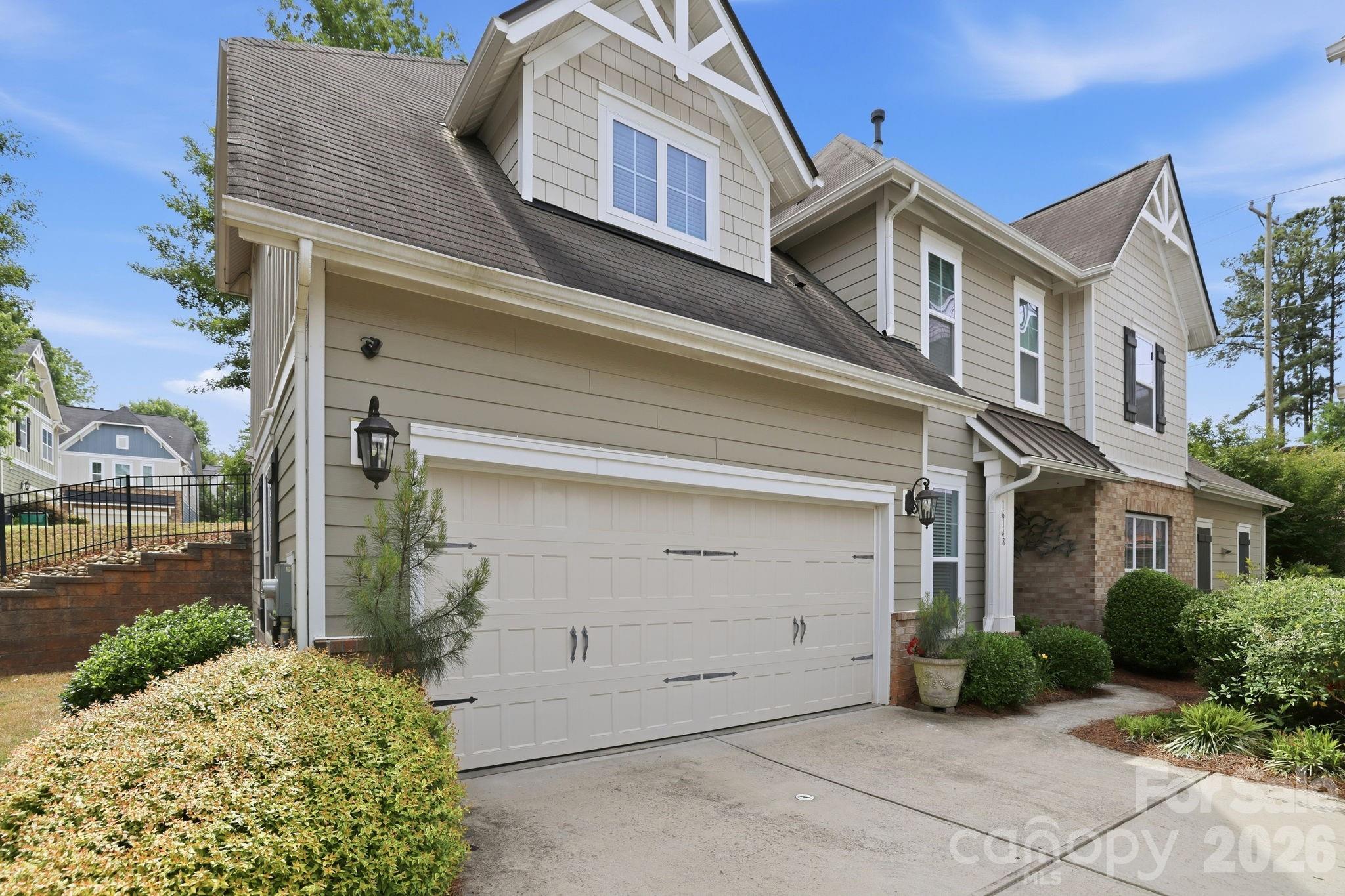 This Ballantyne gem blends modern style, smart design, and low-maintenance living in a way that just makes life easier. Built by Shea Homes in 2016, you’ll notice the quality the second you walk in.

The two-story family room is a showstopper. Sunlight pours in, giving the space an open, airy feel that’s both impressive and comfortable. It flows straight into the gourmet kitchen, where a large island, granite countertops, and stainless steel appliances set the stage for everything from quick breakfasts to hosting friends on the weekend.

The layout is what really sets this home apart. You get two primary suites: one on the main level and another upstairs. Great for guests or multi-generational living. The loft adds even more flexibility, whether you need a home office, cozy reading space, or a spot to unwind at the end of the day.

Step outside and you’ll find a surprisingly private back patio and yard. It’s perfect for morning coffee, evening wine, or relaxed get-togethers.

You get the feel of a single-family home without the weekend yard work. The HOA handles landscaping, so you can spend more time doing what you actually enjoy.

Location? It’s hard to beat. You’re just minutes from shopping, dining, hospitals, and the energy of Ballantyne AMP.