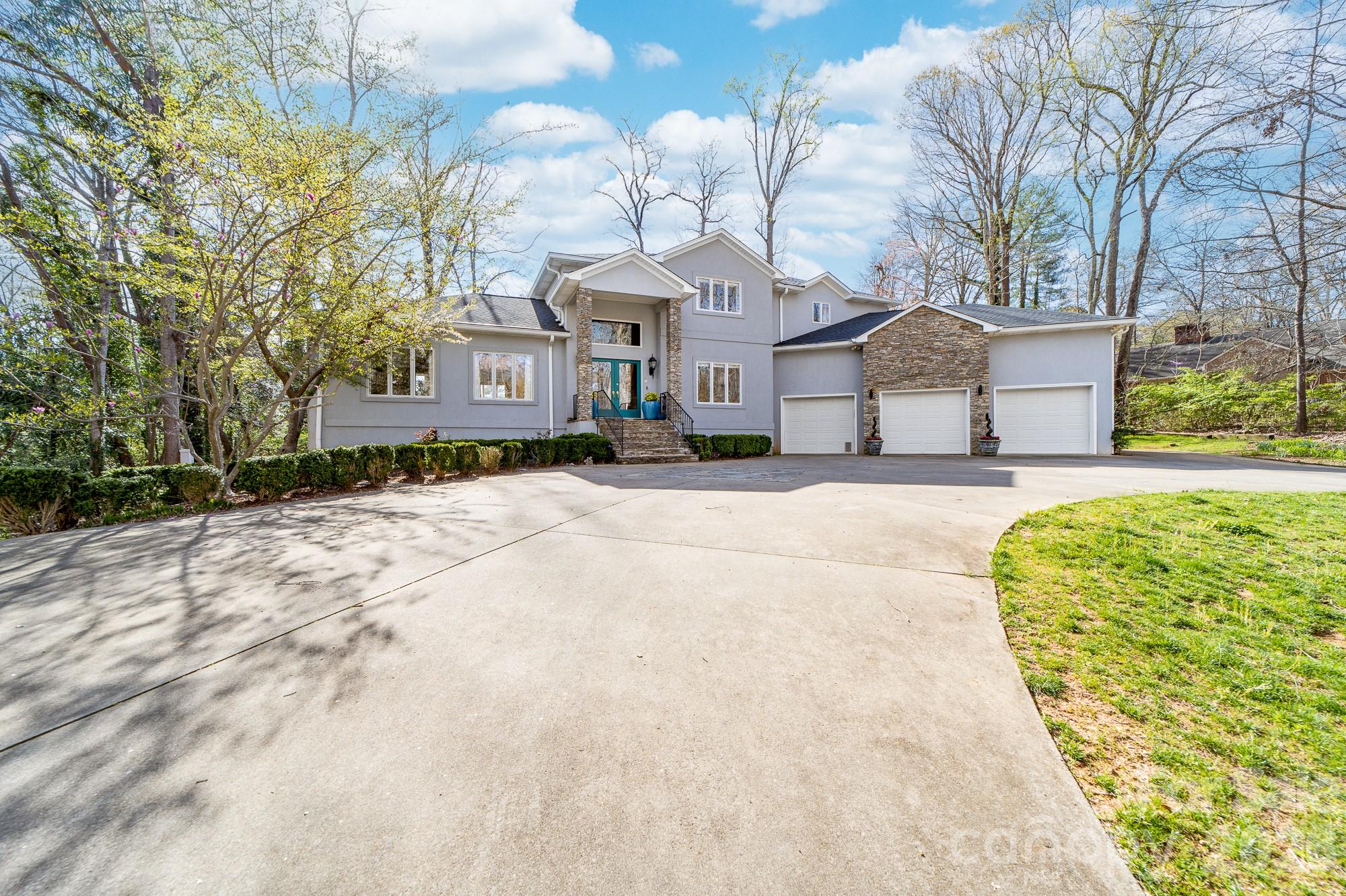 Beautifully updated 5BR/4.5BA home in desirable Shelby neighborhood featuring a fully finished basement and a spacious 3-car garage. The remodeled primary suite is a luxurious retreat with an oversized custom dressing room and stunning ensuite bath. Bright, open-concept main living areas offer ideal flow for entertaining with the kitchen being the central anchor.  Enjoy outdoor living on the screen porch, back patio, by the fire pit circle, playhouse or serene covered hot tub area. The lower level provides flexible space for a den/media room, gym, or guest bedrooms. Private office space on the main level with built-ins. This home offers massive storage on the lower level and in the garage custom built loft. Thoughtfully maintained with modern touches throughout, this home combines classic charm with everyday comfort. Conveniently located near schools, shopping, Cleveland Country Club and major highways for easy access to Uptown Shelby and beyond. Don’t miss this exceptional property!