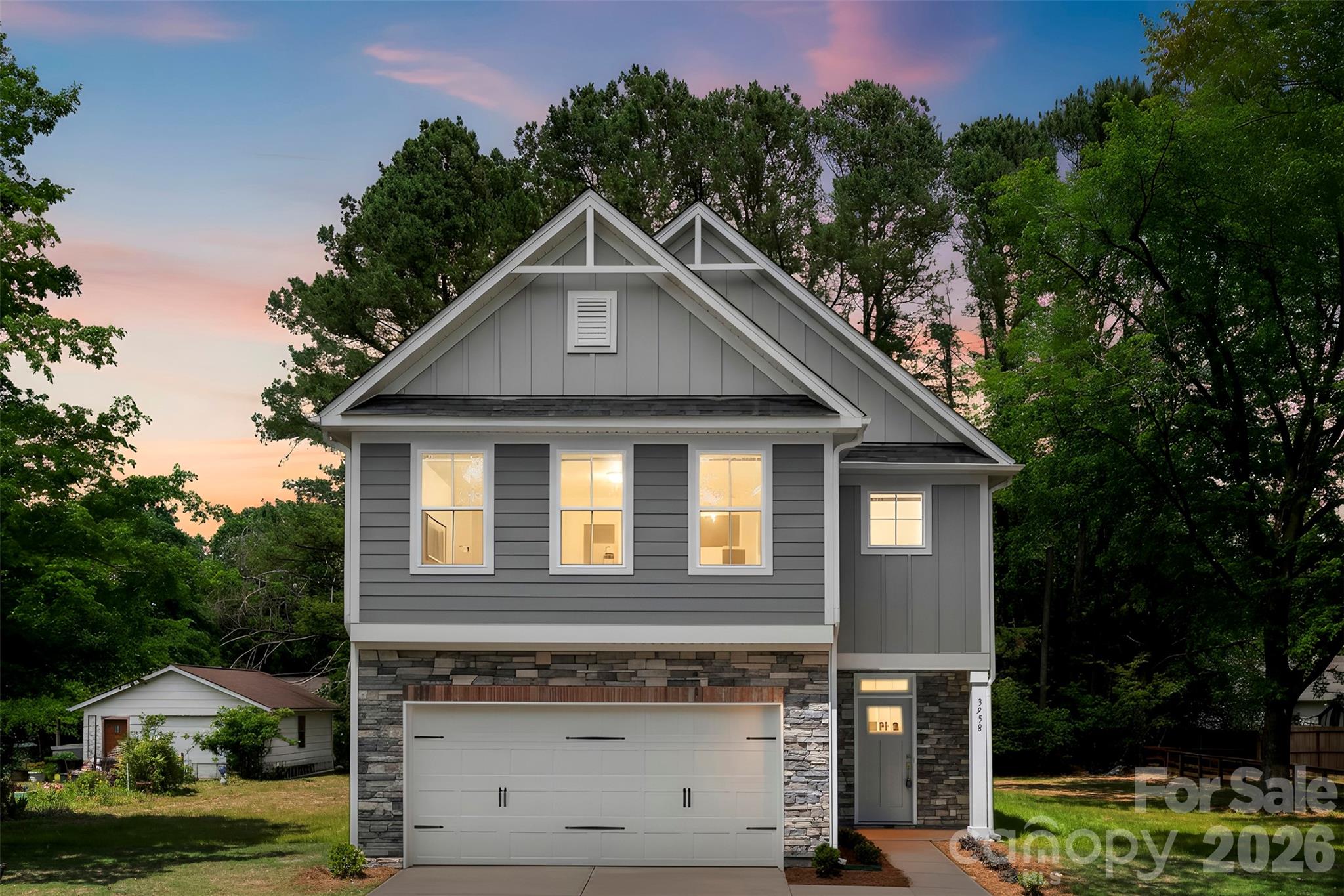 Introducing the Holly Plan by Red Cedar Homes – Elevation B – a thoughtfully designed two-story new construction home blending timeless architecture with modern finishes. The kitchen showcases Dove Shaker cabinetry, quartz countertops, a herringbone tile backsplash with satin nickel accents, island pendant lighting, and brushed nickel plumbing fixtures. Main living areas feature durable Sycamore SPC flooring, while bedrooms include comfortable carpeting. Upstairs, the spacious primary suite includes a walk-in closet and an appointed bath with white shaker cabinetry, quartz countertops, tiled shower walls, and brushed nickel fixtures. The Secondary bedrooms are generously sized with walk-in closets and share well-appointed bathrooms with coordinated tile and finishes.
Additional highlights include Carrera interior doors, brushed nickel hardware, upgraded trim package, ceiling fans in the living room and primary suite, and optional front yard sod with seeded side and rear yard. NO HOA. Up to 3% of purchase price may be applied toward closing costs with preferred lender financing!