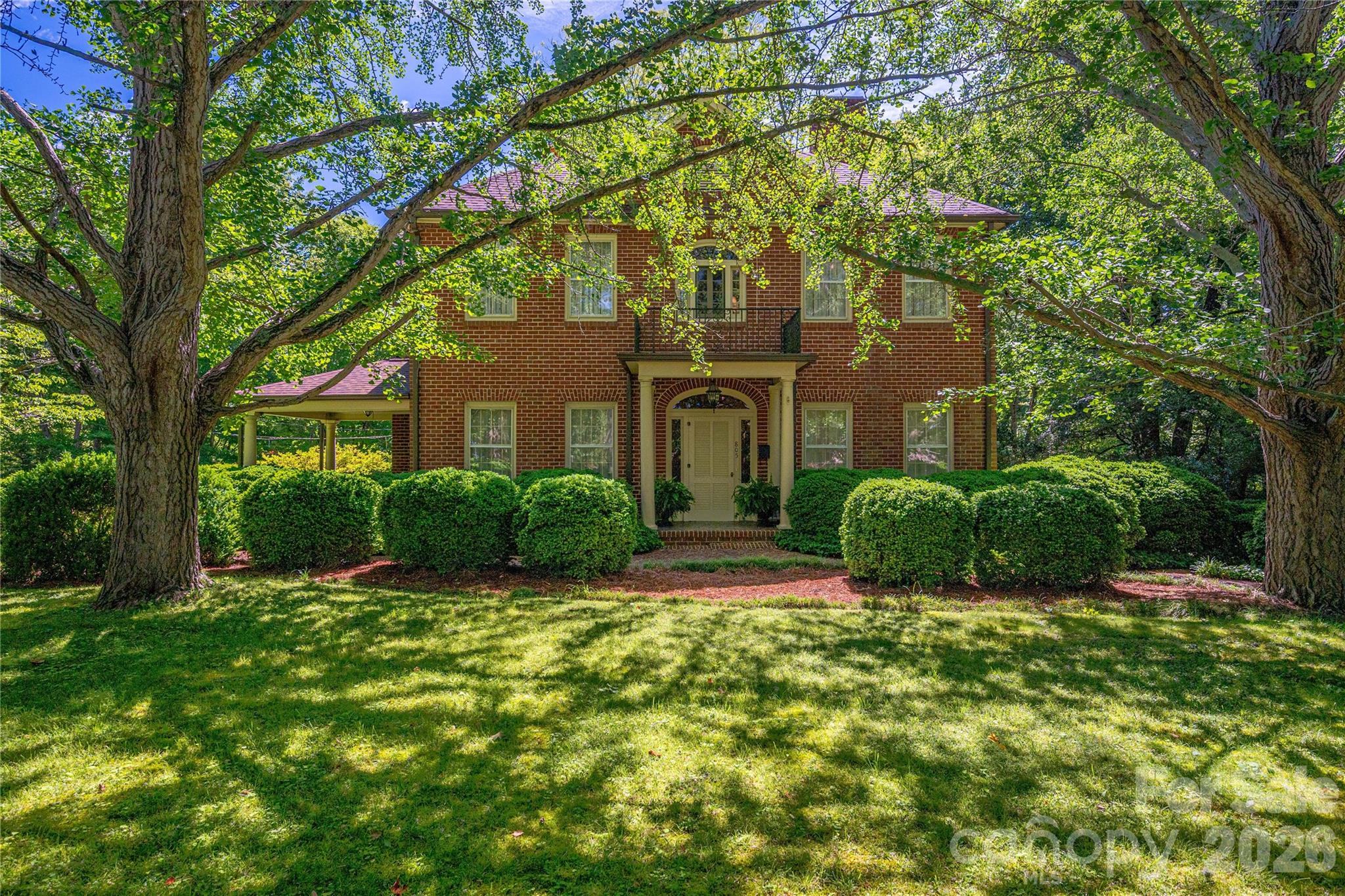 Step back in time and experience the grandeur of this stately historic brick home, beautifully situated on approximately 2 acres in the charming town of Lincolnton. Built in 1910, this remarkable two-story residence with basement blends timeless architectural character with thoughtfully updated kitchen and baths.
Beyond the gated entrance, you’ll discover over a century of craftsmanship, featuring original hardwood floors throughout, spacious rooms, soaring ceilings, and classic details that reflect the home’s rich heritage. The updated kitchen offers modern convenience while preserving the home’s historic appeal. The oversized primary suite includes a huge walk-in closet, and the additional bedrooms are generously sized.
Designed for both everyday living and entertaining, the home boasts a billiard room, bar and entertainment area, inviting balcony porch, side porch, covered rear patio, and an expansive tiled deck overlooking picturesque gardens. Meandering walking paths lead through beautiful gardens, creating a private retreat right in town.
The partially finished basement is heated and cooled and offers incredible flexibility with a workshop, full bath, abundant storage, and multiple flex spaces ideal for hobbies, fitness, office,
A rare opportunity to own one of Lincolnton’s treasured historic homes, offering timeless elegance, modern updates, and exceptional indoor and outdoor living spaces.