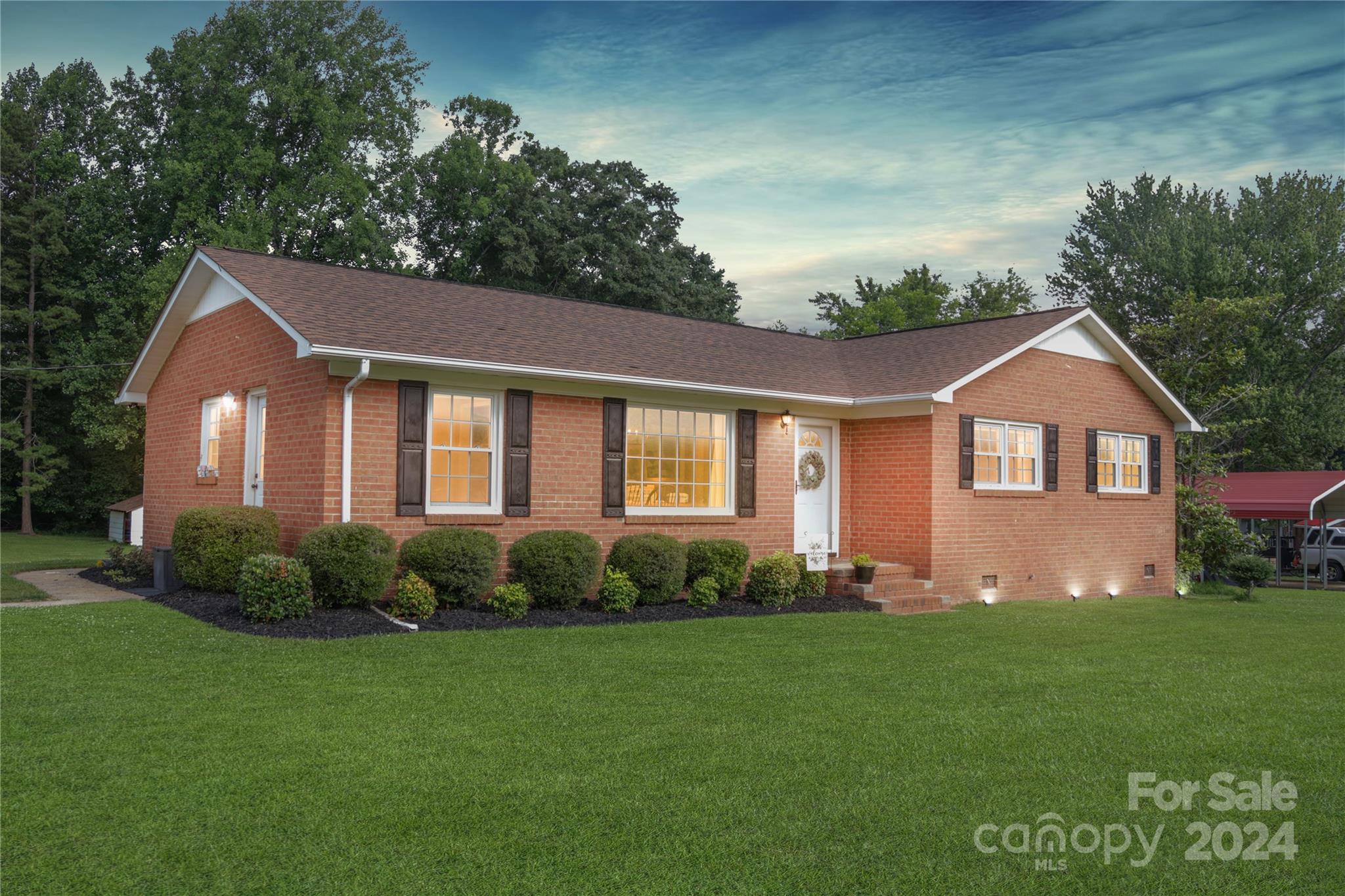 Discover this beautifully renovated brick ranch in Rock Hill, SC! This home features an open living and dining area, a custom kitchen with quartz countertops, new stainless steel appliances, and subway tile backsplash, brand new recessed lighting and light fixtures throughout, fresh paint, LVP flooring, new doors and hardware throughout, and much more! The nearly 1-acre lot is perfect for entertaining outdoors or providing ample space for kids to play unhindered. You’ll also find a newly planted garden and large outdoor storage building with power in the backyard.
Enjoy a welcoming community with no HOA fees and low property taxes, as well as easy access to I-77, Fort Mill, and Charlotte. Schedule your showing today!