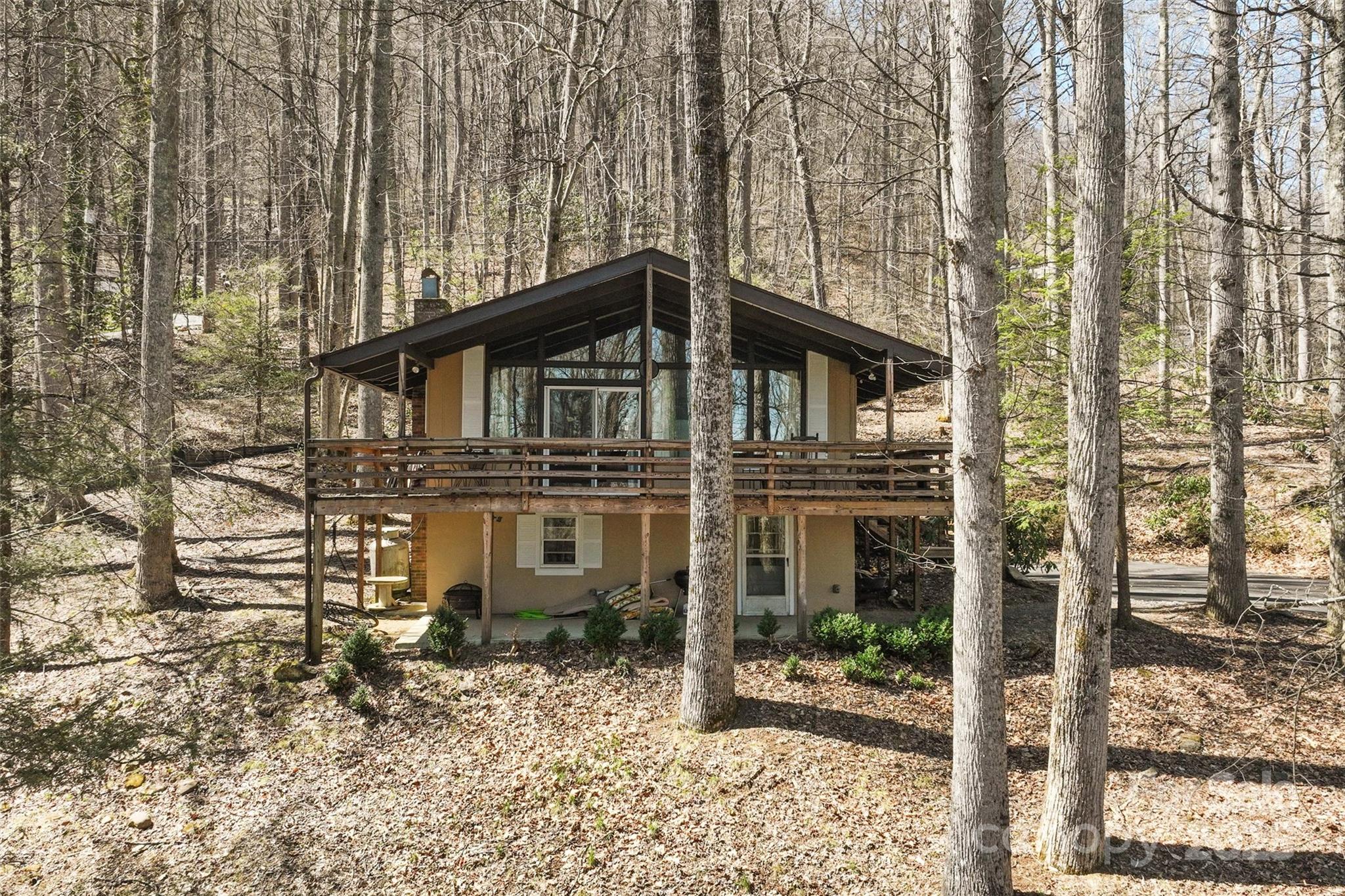 Just reduced! A cherry on top!  In the heart of Maggie Valley.  Paved all the way! This charming 3 bedroom, 2 full bath home has been loved and care for by the same family for generations. A fireplace in this great room with catheral ceilings open to a wonderful deck and view through patio doors. Family room in partially finished daylight basement, with interrior and exterior access.  A perfect opportunty, no restrictions preventing vacation or or short term rentals.  Turn key upon an accepted offer.  A must see!