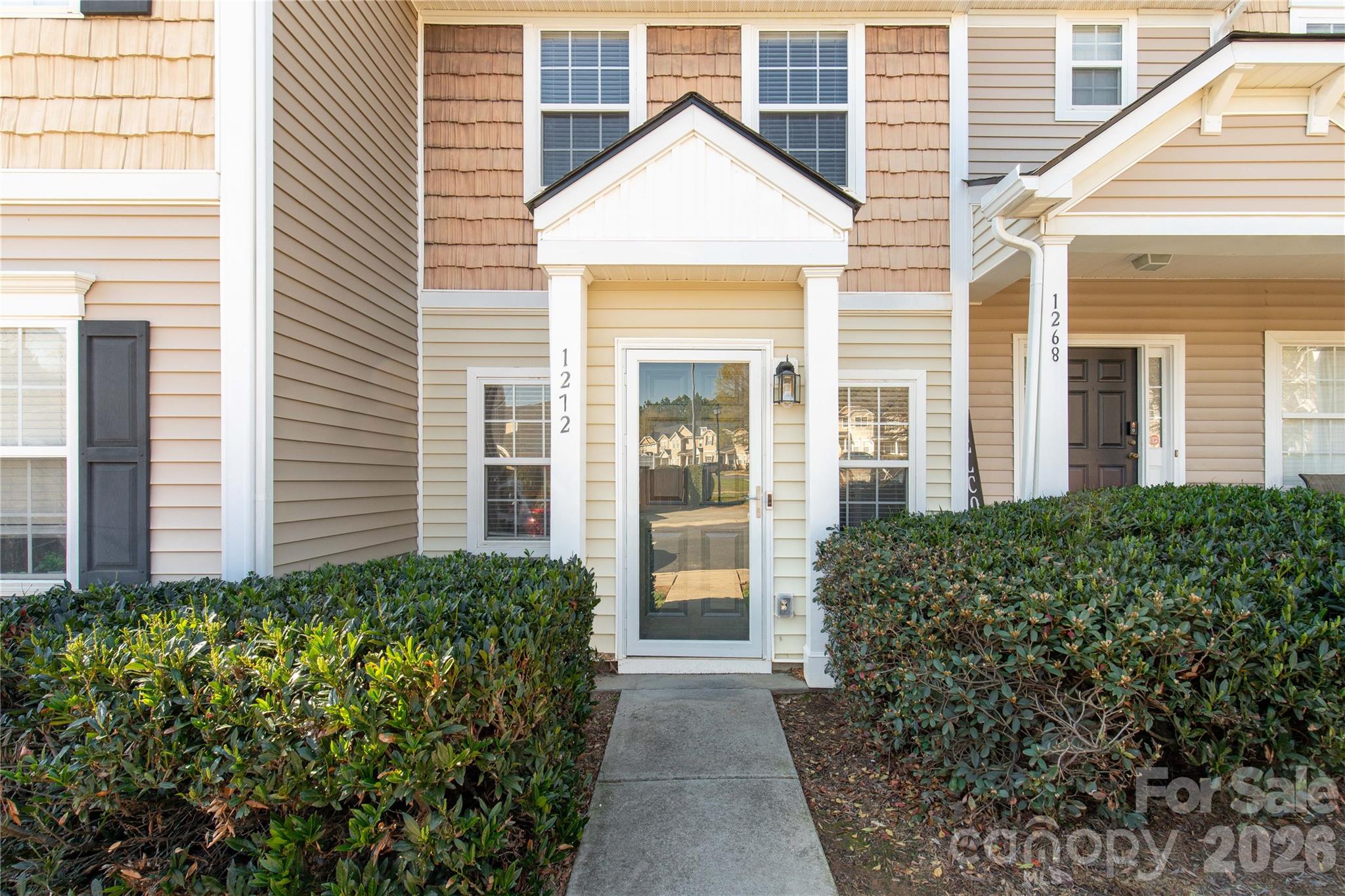 Freshly painted and meticulously maintained, this inviting townhome offers 2 bedrooms and 2.5 bathrooms with a thoughtfully designed layout. The main level features a comfortable living area highlighted by a cozy fireplace and seamless flow into the kitchen, complete with brand-new appliances and ample workspace.

Upstairs, both bedrooms include private en-suite bathrooms, providing convenience and flexibility. A fenced patio creates a private outdoor setting ideal for relaxing, entertaining, or enjoying fresh air. Functional living spaces throughout make this home both practical and welcoming.

Move-in ready and designed for everyday comfort—schedule your showing today.