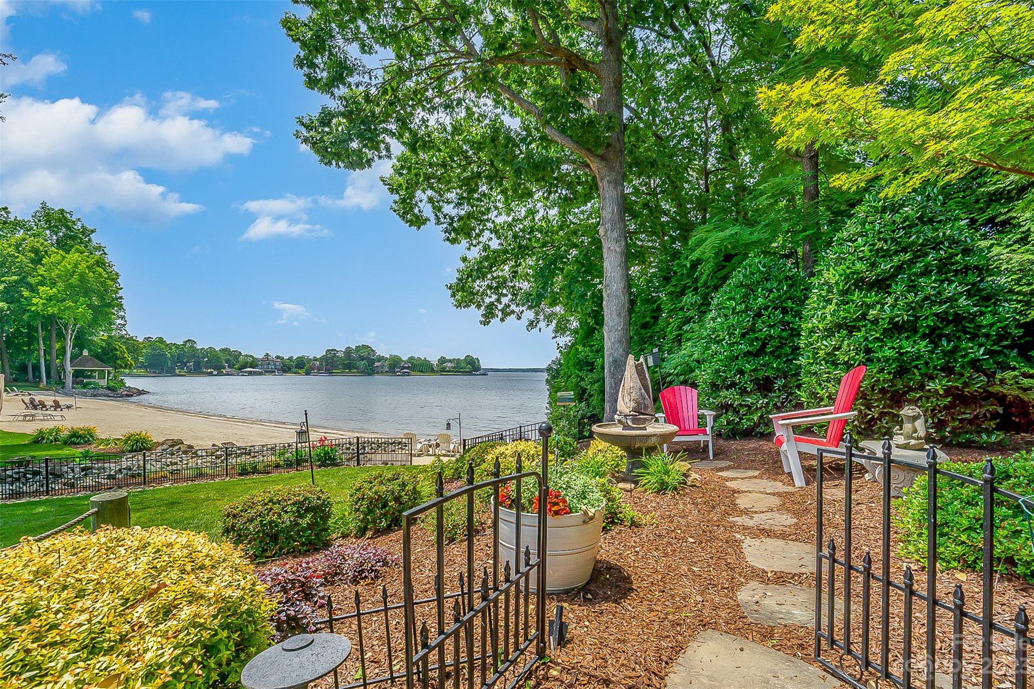 A rare opportunity to own an Award-Winning custom-built home in gated Pointe Regatta! Spectacular sunset views & sandy beach! The moment you enter the open-concept GR you will fall in Love! It features a wood burning FP w/gas starter + conversation area w/expansive windows overlooking the home’s beautiful gardens & LKN. Chef's Kitchen has high end SS appliances, prep sink in island & large pantry.  DR leads to a Screened Porch carefully designed for unobstructed views and easy entertaining! Enjoy regattas and fireworks on the patio w/a FP! Wake up to awesome views in the Primary Bed w/ensuite. Luxury is a soaking tub to relax in after a Day on the Lake. Secondary Bedroom w/ensuite bath + additional 1/2 Bath & Laundry w/utility sink. Three Beds, 2 Baths, Loft & a h/c Storage Room up. Finish above the Garage for ?. Assigned Boat Slip B16 at the Community Dock. More than just a beautiful home w/close proximity to shopping and restaurants. It's a Lifestyle! Don’t let this one slip away!