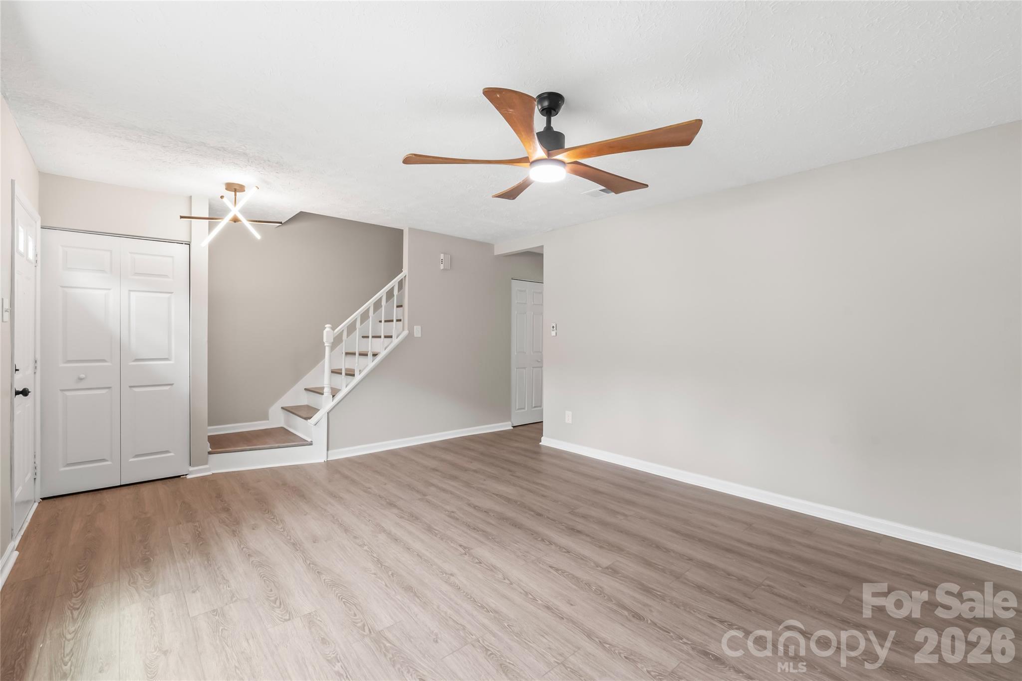 This 3-bedroom, 2.5-bath completely renovated end unit townhouse is an absolute must see. Nestled in the highly desirable Collins Park/Madison Park area offering a prime location convenient to Park Road Shopping Center, LoSo, South End, and more. Inside, new laminate waterproof wood flooring flows throughout meshing with fresh paint and updated lighting. The kitchen boasts all new slow-close gray and white cabinets, granite countertops, Stainless Steel appliances, herringbone backsplash, and new two-way faucet with push button disposal. All bathrooms have been tastefully renovated with new vanities, toilets, faucets, and gorgeous tile to give a luxury feel.  All bedrooms also have laminate flooring and new modern fans. A new stairwell system has been installed along with all new doors, windows, and baseboards in every room. Step through the new sliding glass doors to a fantastic brand new fenced outdoor area for relaxation and privacy. Brand new interior/exterior AC System just installed.  Roof and Siding replaced in 2025! Definition of Turn key!!! All framing, plumbing and electrical work has been permitted.  Situated just 0.5 miles from Park Road Shopping Center, Montford Drive, and Little Sugar Creek Greenway, you're also only 1.5 miles from Freedom Park, 2 miles from SouthPark and South End, and a quick 5-mile drive to City Center or the Airport.