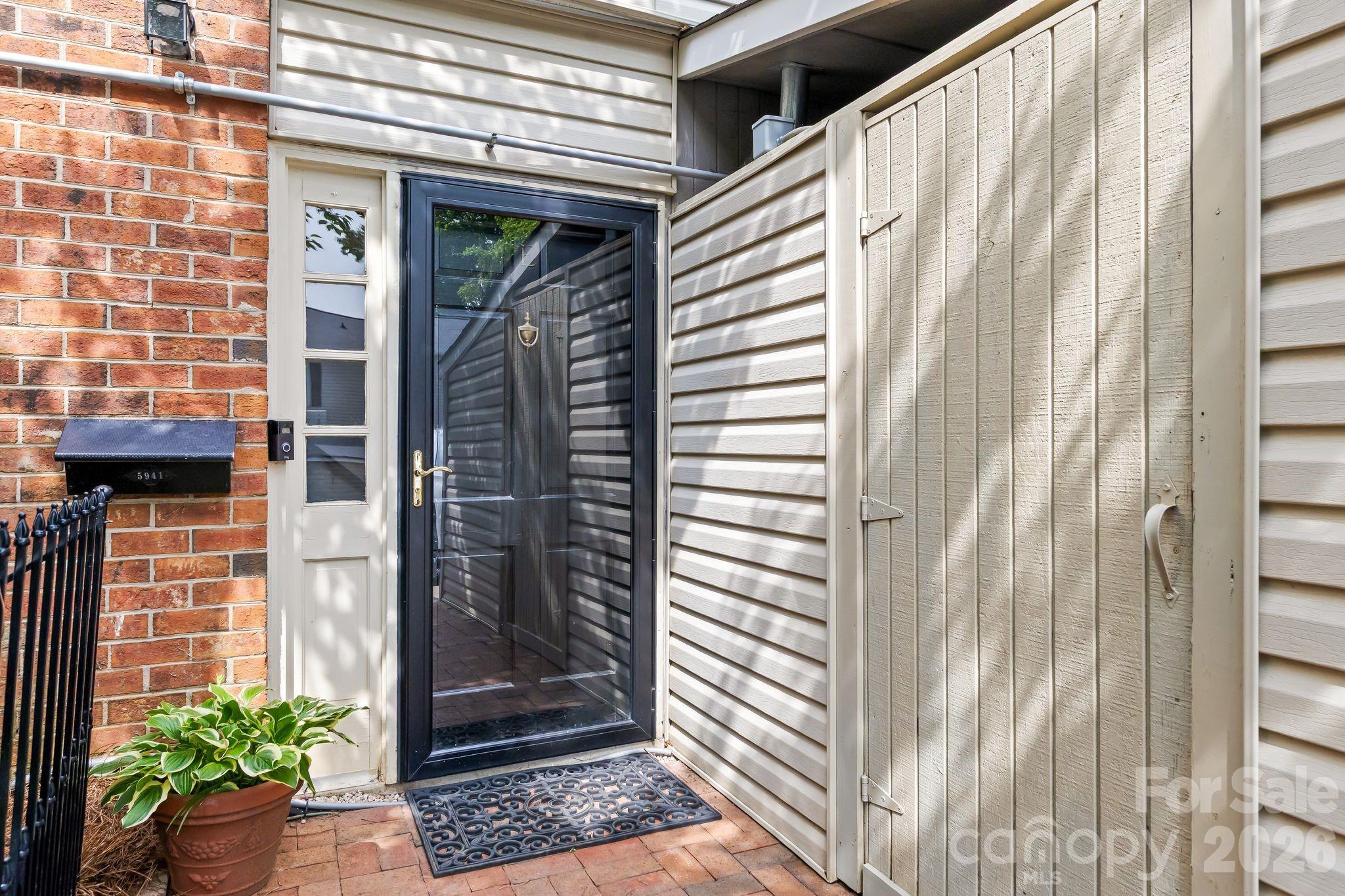 If you’ve been looking for a way to break into one of Charlotte’s most coveted zip codes without sacrificing space, privacy or style, this could be the one. Tucked away within the interior of the community in the heart of SouthPark, welcome to 5941 Quail Hollow Road, Unit E. Freshly painted and thoughtfully updated, this two-story townhome stands out from others in the community with its desirable flex space, excellent storage, and screened-in porch—features not commonly found in Quail Hill. From the moment you step inside, you’ll appreciate the warm and inviting feel, highlighted by brand-new luxury vinyl plank flooring, character-filled built-ins, and a spacious living area designed for both everyday living and entertaining. The layout flows seamlessly into the dining area and eat-in kitchen, where recent updates include a brand-new refrigerator, dishwasher, and garbage disposal. Just off the kitchen, a versatile flex space provides valuable additional living area that can serve as a home office, reading nook, workout area, playroom, or hobby space. An adorable half bath completes the main level. Upstairs, you’ll find brand-new carpet throughout and two generously sized bedrooms. The primary suite features a walk-in closet and a beautifully updated bathroom, while the second bedroom is equally generous in scale and enjoys the convenience of its own private vanity area with shared access to the tub and shower. One of the home’s most distinctive features is its screened-in porch, creating a true outdoor living space that can be enjoyed throughout much of the year. The porch opens to an additional patio area, giving you two separate outdoor living spaces—perfect for morning coffee, entertaining guests, or relaxing at the end of the day. Unlike some homes located along the perimeter of the community, this unit enjoys a quieter interior location, offering added privacy and a peaceful setting. Experience the easy, lock-and-go lifestyle as the HOA covers water, trash, sewer, lawn care, and the upkeep of the community pool and clubhouse. Thoughtful storage throughout the home, including generous closet space, adds to the functionality and convenience of everyday living.
A truly unbeatable location—directly across from the Harris YMCA and next to Beverly Woods Elementary with sidewalks that lead you straight to the shopping, dining, and entertainment of SouthPark Mall. Plus, your commute to Uptown and Ballantyne is only minutes away. Whether you’re a first-time buyer looking for a move-in-ready home, a professional seeking low-maintenance living in a prime location, or an investor eyeing a community with no rental cap, this is a fantastic opportunity to own your piece of SouthPark. 5941 Quail Hollow Road Unit E offers a rare combination of value, comfort, and lifestyle in one of Charlotte’s most desirable neighborhoods.