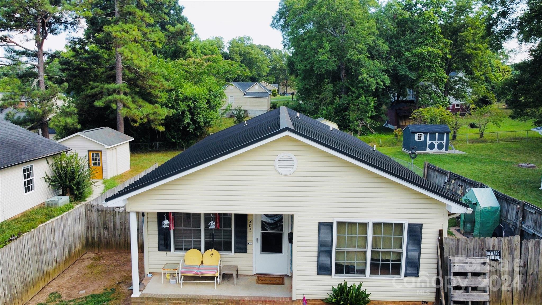 Must see this desirable 3Br/2Ba ranch with convenient Bessemer City location. Lots to love with this home including: one-level living; efficient floor plan; cathedral ceiling in living room; owner's suite with ensuite bathroom; extensive shelving systems in all closets; covered front porch; level and fenced back yard; multiple sheds including 10x10 and 8x12 with attached covered 8x10 open area; newer metal roof (2020) and HVAC with remaining warranty. $5,000 redecorating allowance with acceptable offer. Inquire about virtual tour. Special financing incentives...Ask about potential grant money through preferred lender (3% of purchase price toward down payment plus $7,500 toward closing costs). Come make this yours today!