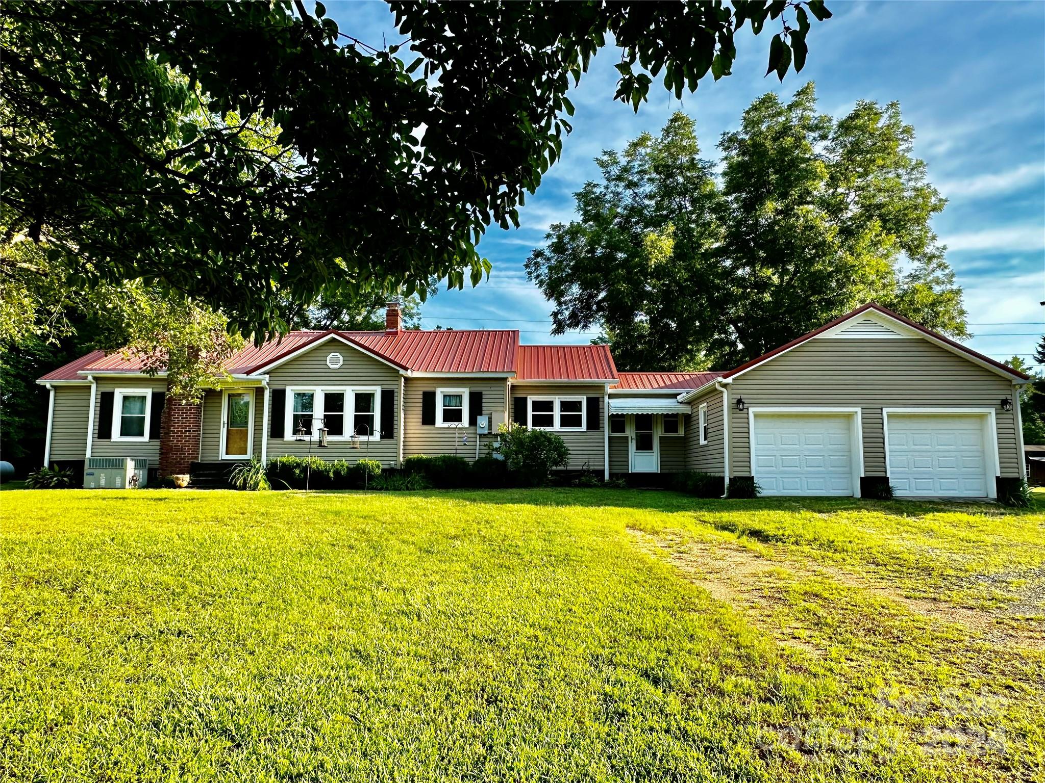 Your farmhouse dreams await! Adorable updated farmhouse sits on a beautiful 10 acre parcel that is ready and waiting for you and your farm friends. Complete with multiple pastures possibilities, chicken coop and plenty of garden spots, this property has whatever you need. The home has been updated with wood paneling and ship lap, convenient laminate floors, and that must have claw foot tub! The kitchen has a new farmhouse sink, dishwasher and granite counters. Love the charming honey wood ceilings. The master has a walk in closet and private bath and french doors that go out to the picturesque back deck and yard. Other offerings include a 2 car attached garage, a workshop, a fairly new storage shed, several lean-to's for storing your farm equipment, feed sheds and a huge, gorgeous red barn. All structures have electricity. You have to see all it has to offer to truly appreciate the peacefulness and beauty. Conveniently located a short 40 minute commute to Charlotte or Columbia.