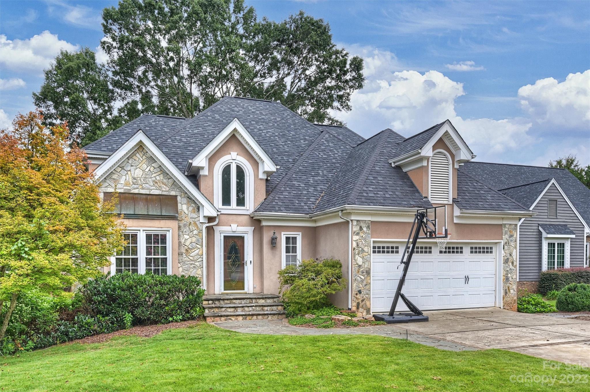 Take a minute to savor the view of the pond from the top or bottom deck of this beautifully built home with Lots of windows and natural light to enjoy the view.  5 spacious bedrooms and bonus room or 6th bedroom option.  Primary bedroom on the main, 4.5 bathrooms , Upstairs has 3 bedrooms including a Prince/Princess ensuite  or 2 beds and bonus. Encapsulated crawl space, Super large kitchen with SS appliances, Double wall oven and open to the 2 story family room with stone surround gas log fireplace.  Basement boasts 9 foot ceilings, 2 full bedrooms, Large full kitchen/dining area, Full bathroom and Great room with 2nd gas fireplace. Could be option for 2nd living quarters. 2 laundry areas, Walk across the street to the pool and amenities.  Office on Main or Dining room option.  TONS of storage. Low SC taxes and close to shopping and amenities