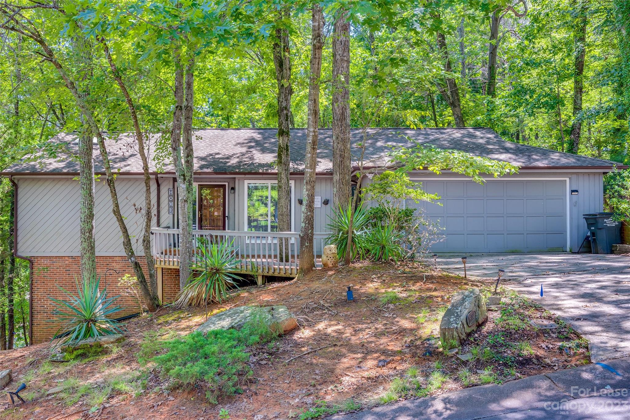 Charming custom 3 bedroom 3 bath Ranch in Tega Cay with Primary on the main! Primary features, vaulted ceiling and sliding doors to screened porch. The primary bath has a dressing area, a walk-in closet, and a walk-in shower. Secondary bedrooms are on the lower level along with a flex space with a wet bar, sliding doors, and a deck. Large office space on the upper level next to the kitchen and dining area with built-ins and a closet. The Great Room has a vaulted ceiling with a stone wood-burning fireplace that is open to the eat-in kitchen. The kitchen has a built-in desk, SS appliances with loads of storage and a pantry. The laundry room is on the main at the garage. Pets allowed but conditional. NO CATS. Some community features require membership.
