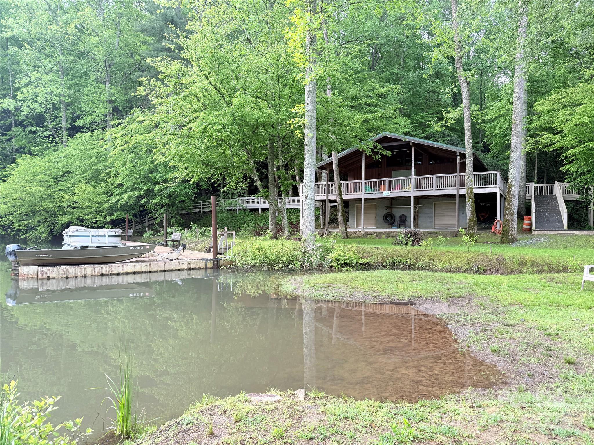 Discover Lot #17 at Summit Landing in Zirconia, NC—a prime 1.63-acre parcel perfect for your dream home. Nestled in a serene mountain setting, this lot offers deeded Lake Summit access, complete with a community boathouse, storage, and dock for endless water adventures. Enjoy proximity to premier hiking and mountain biking trails, blending outdoor excitement with tranquil living. Build your retreat in this coveted community, where nature and convenience meet. Don’t miss this opportunity to own a slice of mountain paradise!