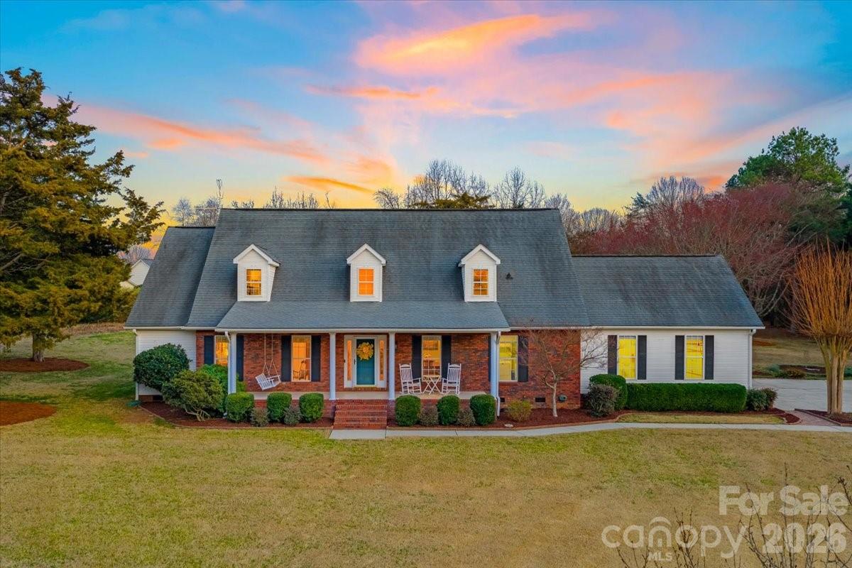 ** Multiple Offers. All offers due by 5pm Friday 3/20** Welcome to your Fort Mill oasis! This charming 5-bedroom, 3.5-bathroom home sits on 1.05 acres in the desirable Hamilton Place neighborhood with no mandatory HOA, offering privacy, space, and flexibility rarely found in Fort Mill, South Carolina.

A standout feature of the home is the two main-level ensuite bedrooms, ideal for multi-generational living, guests, or a flexible layout to suit your needs. The main living areas feature luxury vinyl plank flooring throughout the dining room, breakfast area, kitchen, and laundry room.

The newly remodeled kitchen is designed for both everyday living and entertaining, featuring quartz countertops, a stainless 60/40 sink, and built-in appliances including a wall oven, microwave, cooktop, and dishwasher, all filled with natural light.

Enjoy classic Southern living on the expansive front porch, or relax and unwind in the tiled sunroom with motorized shades, a bright and airy retreat offering peaceful backyard views and year-round enjoyment. The spacious backyard provides endless possibilities for gatherings, gardening, play, or simply enjoying the outdoors.

Upstairs, additional bedrooms provide space for family, guests, or a home office, with generous storage throughout. The property also includes a three-car garage with utility shelves, cabinets, and a workbench, perfect for projects, hobbies, or extra storage.

With over an acre of land, no mandatory HOA, and a versatile layout, this Fort Mill home delivers space, comfort, and rarely found charm in one of the area’s most sought-after neighborhoods.