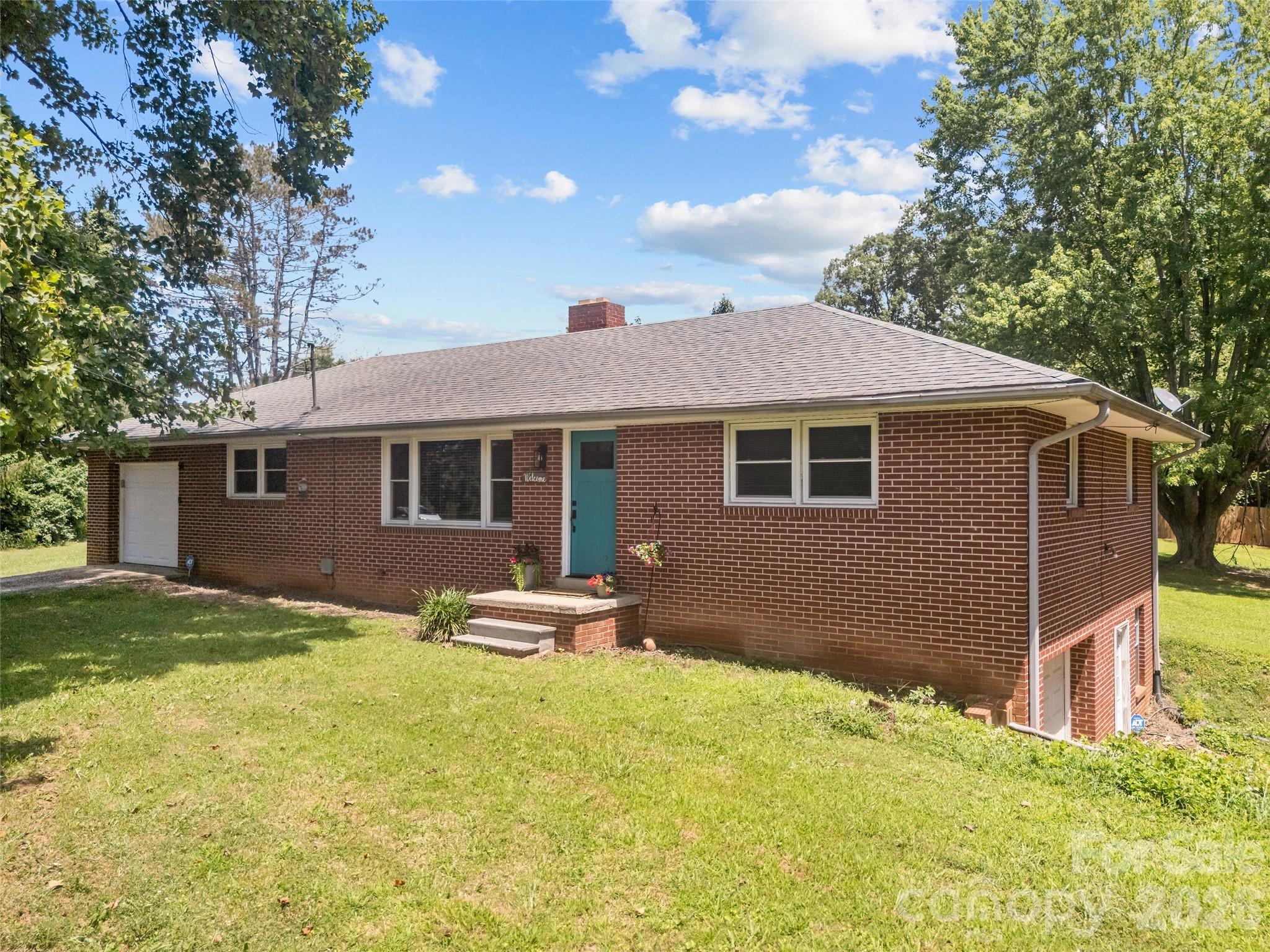 No HOA, no restrictions, and endless flexibility just minutes from Airport Road. This brick ranch sits on 1.24 private acres and features a rare setup with a separate driveway and private basement entrance, ideal for a home business, guest space, or future income potential.


Lovingly maintained over generations, and extremely clean, this home reflects true pride of ownership. 
The main level features hardwood floors, an updated kitchen with granite countertops, and an easy, functional layout. It's the perfect balance for a first-time buyer or someone seeking a home that can also support a business or flexible lifestyle.


Step outside to a private, tree-lined backyard with ample parking in the front. All just 5 minutes from shopping, dining, and I-26!

If you are looking for flexibility, freedom, and room to grow, don't miss this one.