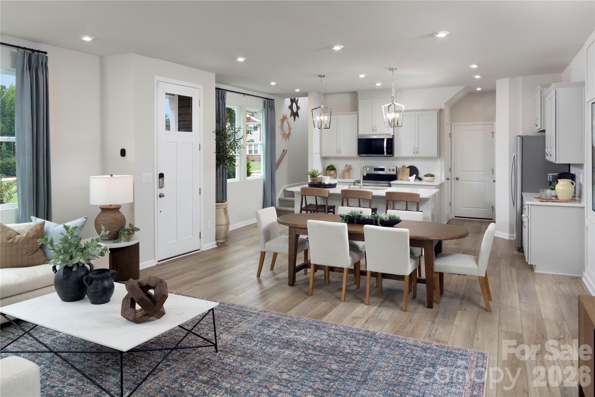 Welcome to the popular Vienna floorplan in the sought-after Stonesummit at Reedy Creek community. This well-designed townhome offers an open, functional layout with spacious living areas, abundant natural light, and modern finishes throughout. The seamless flow of the main living spaces is ideal for everyday living and entertaining. The upper level includes a private primary suite along with additional secondary bedrooms and bathrooms. Contemporary finishes and ample natural light enhance the home’s functional design. Conveniently located with easy access to Uptown Charlotte, shopping and dining in University City, live entertainment at PNC Music Pavilion, and outdoor recreation at Reedy Creek Nature Preserve and Park.