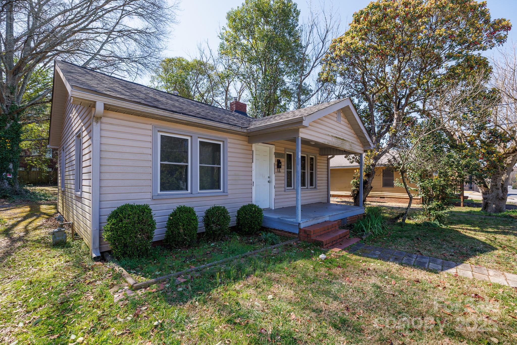 Charming 2-bedroom home in a prime Fort Mill location! This property features a welcoming front porch, a spacious rear deck perfect for relaxing or entertaining, and a tankless water heater. Conveniently close to downtown Fort Mill, it offers easy access to shops, dining, and local amenities. Zoned LC (Local Commercial), this versatile space allows for small shops or businesses—check zoning regulations for specific uses. Whether you're looking for a cozy home or a business opportunity, this property has great potential!  Cross-listed as commercial MLS# 4234188