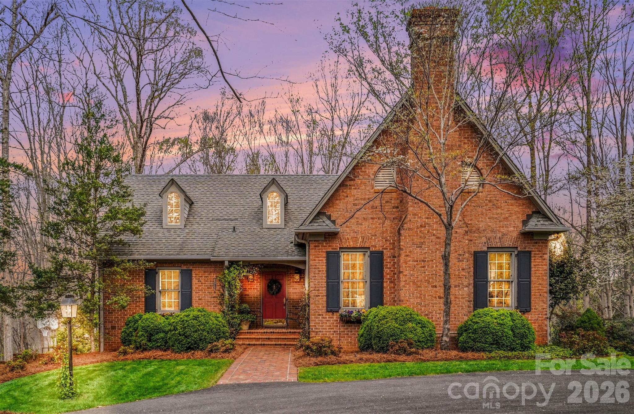 FIVE ACRES of PRIVACY just TWO MILES from the CENTER OF TOWN--do not miss this quality-constructed jewel of a home! Built by highly respected contractor Foy Brackett, no detail was overlooked. Thick moldings, built-in features, gorgeous hardwoods, and high-end materials define this single-owner home that has been lovingly maintained since construction. A circle drive provides an inviting entrance to the beautiful brick exterior featuring a welcoming front porch and overflowing window boxes. Enter into a vaulted-ceiling foyer/central hall that connects the living areas and enables great flow! This is a great entertaining home with the convenience of a centrally located half bath in the main hall! Beautiful, oversized windows, French doors, and transom doorways throughout the interior provide tons of natural light. The bright and airy living room has a fireplace, built-in bookshelves, and detailed millwork. The lovely formal dining room has built-in corner cabinets with chair rail and custom wainscoting detail. The spacious kitchen and breakfast area are truly the heart of the home and connect to the vaulted ceiling sun room with gorgeous fireplace focal point. Notice the reclaimed pine beams, taken from the seller's family barn built in early 1800s, and the historic pine mantle--an antique from the old Inverness Hotel in Lincolnton. Another highlight is the screened porch off of the family room which is truly an additional living space! Permanently installed vent hood makes grilling easy and stress free! Primary bedroom is on main floor with two walk in closets, en-suite bath with dual vanities and separate bath/shower/water closet space. Additional door leads directly to the utility room for added convenience! Utility room has built-in desk, wet bar, and large laundry closet. This is a great butler's pantry while entertaining! DO NOT MISS the door that leads to the walk-up attic space. Sellers have used this for convenient storage, BUT it could be finished to provide additional bedrooms/bathrooms/living space! Downstairs, you will find an additional rec room/office with fireplace, 2 large bedrooms, and an additional full bath. For added convenience, there is an additional SINK behind bifold doors in one of the bedrooms! There is great storage in multiple closets downstairs w/ a great drop zone coming in from the garage. An unfinished space in the basement is where you will find most of the mechanical components, and it is a spacious workshop, too! There is a garage, carport, and extensive driveway for plenty of parking, playing, or space for projects. Established landscaping provides an idyllic setting. An additional lot could be carved off as a building lot! Do not miss this beautiful cottage in the privacy of your own woods! Peaceful (and convenient!) living at its FINEST! Call today!