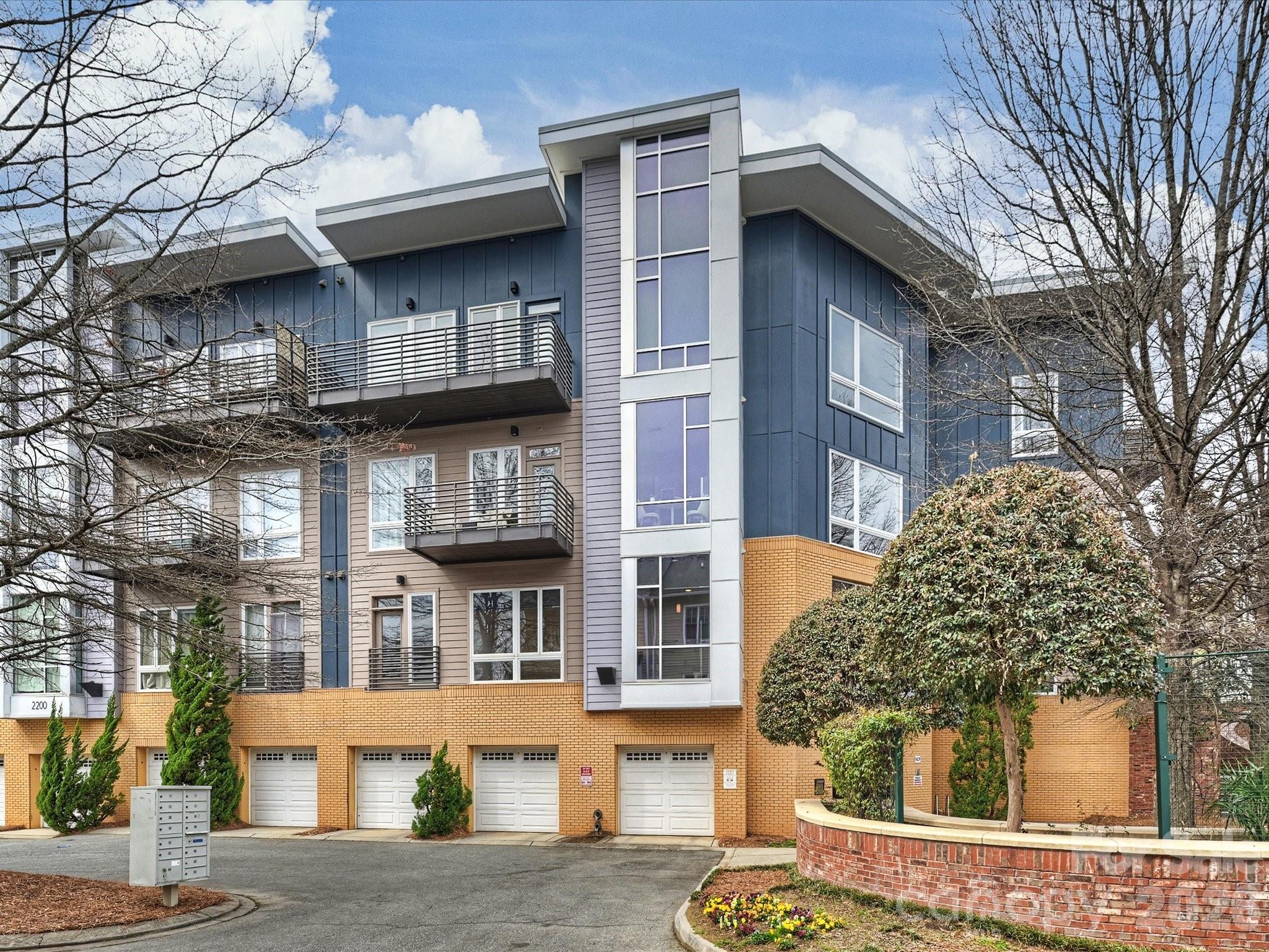 Light and bright condo in a fantastic location!  Enjoy all the restaurants and shopping that Southend and East Blvd have to offer within walking distance.  This freshly painted move-in ready home features high ceilings and expansive windows.  Open concept plan is designed for entertaining and maximizing space.  Easy-care laminate flooring in the living/dining/kitchen area, with new carpet and padding in the bedroom.  The condo is located on the 2nd floor and overlooks the sunny community courtyard.  The building lobby includes an elevator for easy access.  An extra-deep private garage (#10) provides parking and storage, just steps away from the building lobby - see showing instructions for the code to open it.
