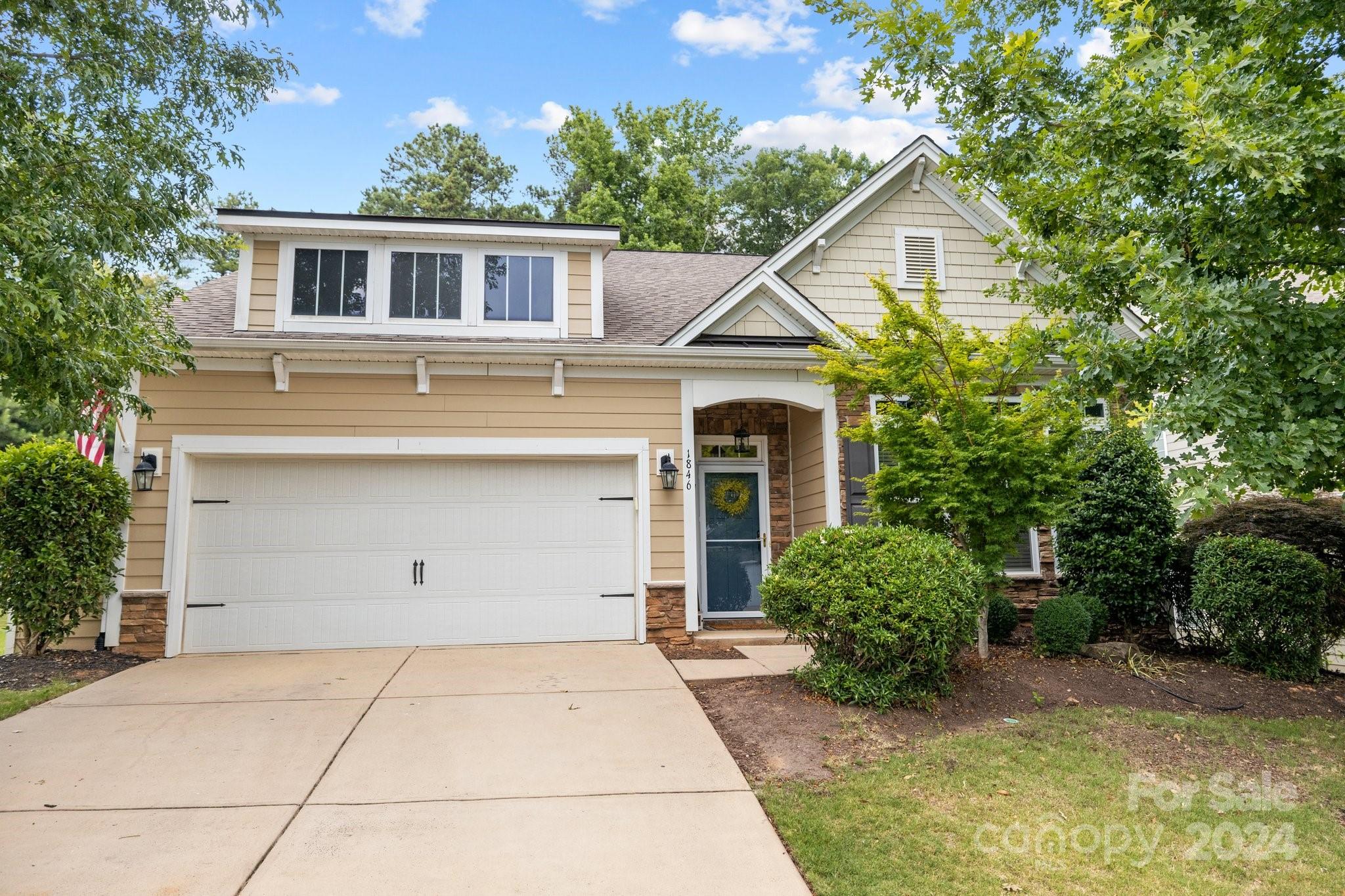 A must see! This stunning 1.5-story home has an open floor plan that features an extended living room with a sunroom and a beautiful eat-in kitchen and TONS of natural light. Enjoy the convenience of having the primary bedroom, two additional bedrooms, and laundry/mudroom all on the main floor! Upstairs, discover a large bonus room, an additional bedroom, and a full bath. The backyard offers privacy landscaping for ultimate relaxation by the outdoor fireplace. You don't want to miss all the added custom features this home has to offer- from the mudroom to the kitchen and ensuite bathroom. Come see all this home and the amenity-filled community have to offer.