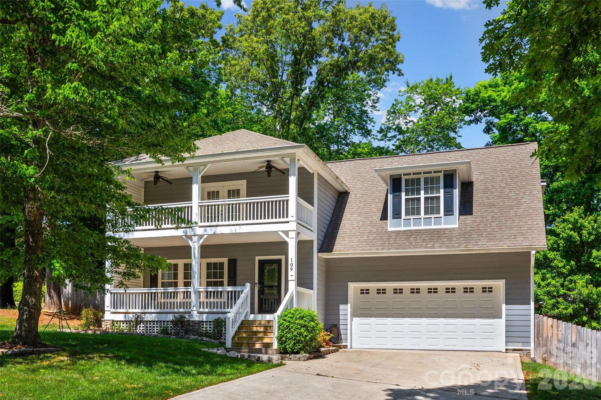 Welcome to this Charleston-style Southern charmer in the highly desired Brookridge Shores community with no HOA, located less than 2.3 miles from Hager Creek Lake Norman Access Area. Built in 2019, this home offers three bedrooms, two and a half bathrooms, and the perfect blend of style, comfort, and function. The double covered front porches create standout curb appeal, while the interior features a spacious living room with built-ins and a fireplace, a large dining room with wainscoting detail, and a custom kitchen with 42 inch cabinetry, granite countertops, soft close drawers and doors, stainless steel appliances, and an eat-in breakfast area that opens to the back deck. The sellers have added high-end LVP flooring and completed custom bathroom updates throughout the home, giving the interior a fresh, elevated feel while keeping its warm Southern character. Upstairs, you’ll find three generously sized bedrooms, a large bonus room, and a beautiful primary suite with double vanities, a custom tiled shower, soaking tub, and private covered balcony perfect for morning coffee. Outside, enjoy a wood privacy fence, irrigation in back, deck for grilling, and an oversized two-car garage with opener and keyless entry. Thoughtful updates, timeless charm, and a great location make this home truly move-in ready. Bring us your best offer!