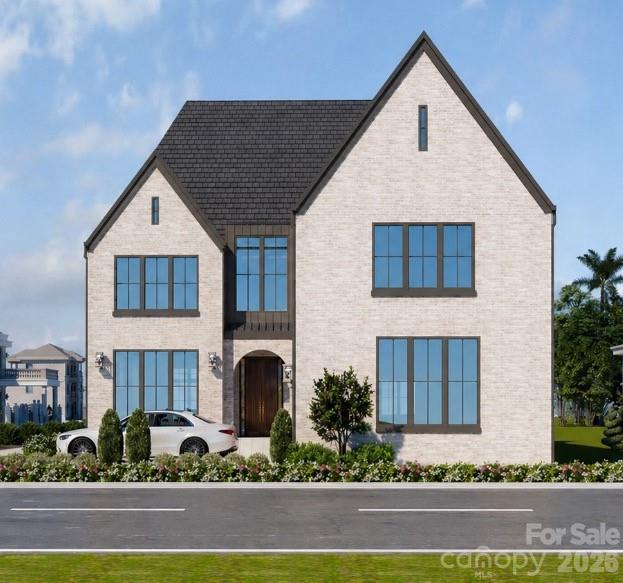 Set on a premier corner lot in the heart of Dilworth, just moments from South Blvd with a short walk to nearby dining and retail, this 5,514 sq ft brick residence reflects European design with a touch of modern, offering a refined lifestyle comparable to luxury Uptown Charlotte living within one of the city’s most established neighborhoods. The main level is thoughtfully curated, anchored by a private primary suite featuring a spa-inspired bath and dedicated laundry. Light-filled living spaces unfold seamlessly, centered around a beautifully designed kitchen that balances elegance with everyday functionality. A scullery and custom cabinetry provide added convenience, while white oak flooring and tailored millwork contribute to the home's understated sophistication. The inclusion of an ELEVATOR enhances accessibility and makes this a remarkable age in place home. The covered rear porch extends the living space outdoors, overlooking a flat fenced backyard and creating a natural connection between interior and exterior. Spacious back yard has potential for future pool installation. Upstairs, four additional bedrooms are complemented by a home MOVIE THEATER including projector and movie screen, second laundry, and a spacious bonus room with fireplace. A private balcony offers elevated views toward Uptown Charlotte, adding a distinctive finishing touch. An exceptional opportunity to own a newly constructed home of quiet luxury and architectural intention, set within one of Charlotte’s most desirable addresses. ***Includes a 6 year home warranty!!!***