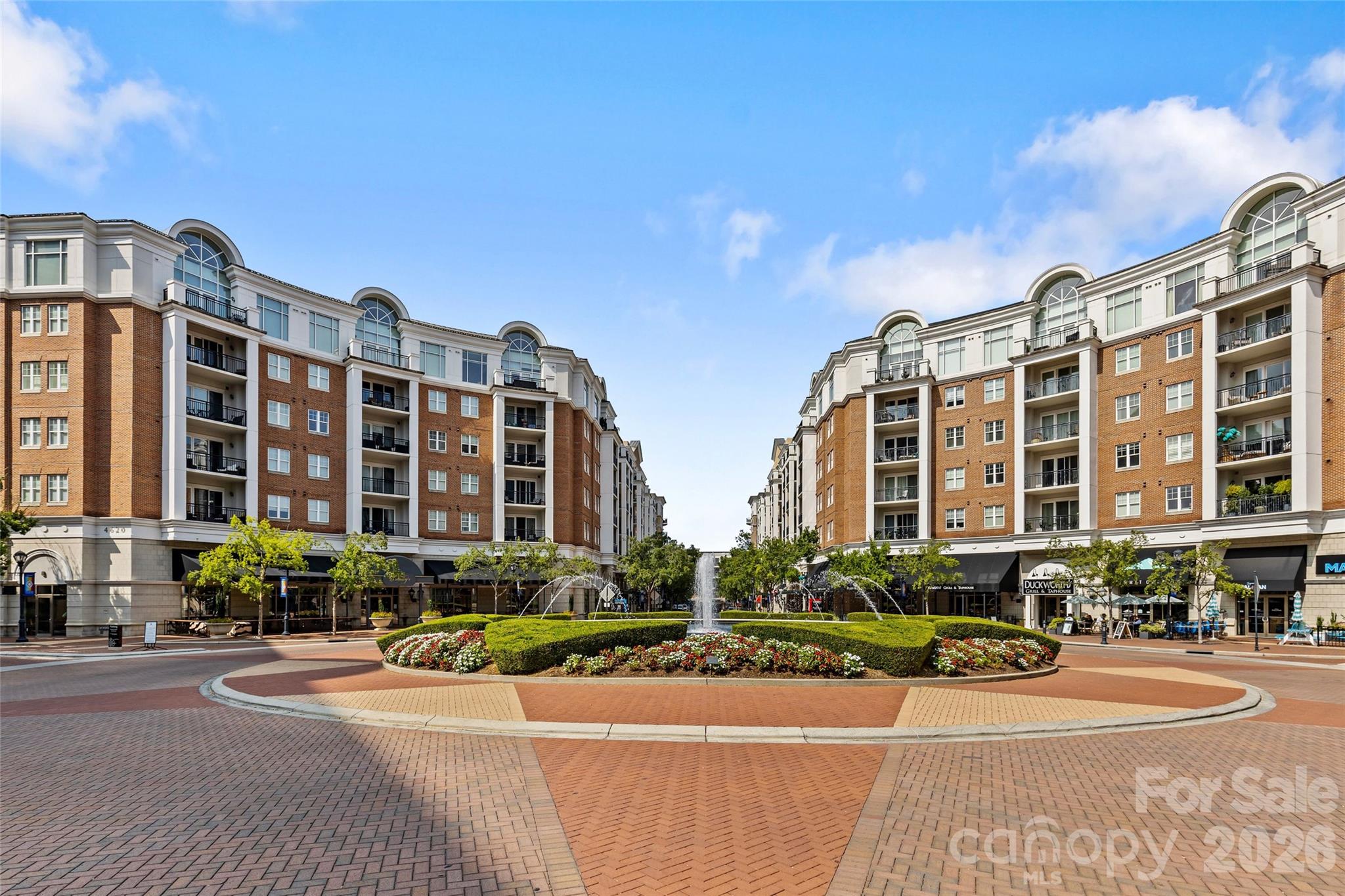 Welcome to Piedmont Row, ideally situated in the heart of SouthPark with premier dining, shopping, and everyday conveniences just outside your door. This sixth-floor condo is a thoughtfully designed 2-bedroom, 2-bath residence featuring a rare double balcony with two access points and beautiful city views. Inside, the open-concept floor plan offers tall ceilings, abundant natural light, a spacious kitchen island, and excellent storage throughout. Each bedroom includes an ensuite bathroom and large walk-in closet, combining both comfort and functionality. The primary suite features a soaking tub, linen closet, and in-unit washer and dryer, and direct access to the serene, expansive balcony. This unit is exceptionally quiet, with no restaurants located directly below, and also includes its own radon mitigation system. Residents enjoy access to desirable building amenities such as a rooftop pool (located on PH level), grilling area, recreation room, and 24/7 security. Enjoy some of SouthPark’s most popular destinations just steps away, including Harris YMCA, Del Frisco's Double Eagle Steakhouse, Summit Coffee, and more!