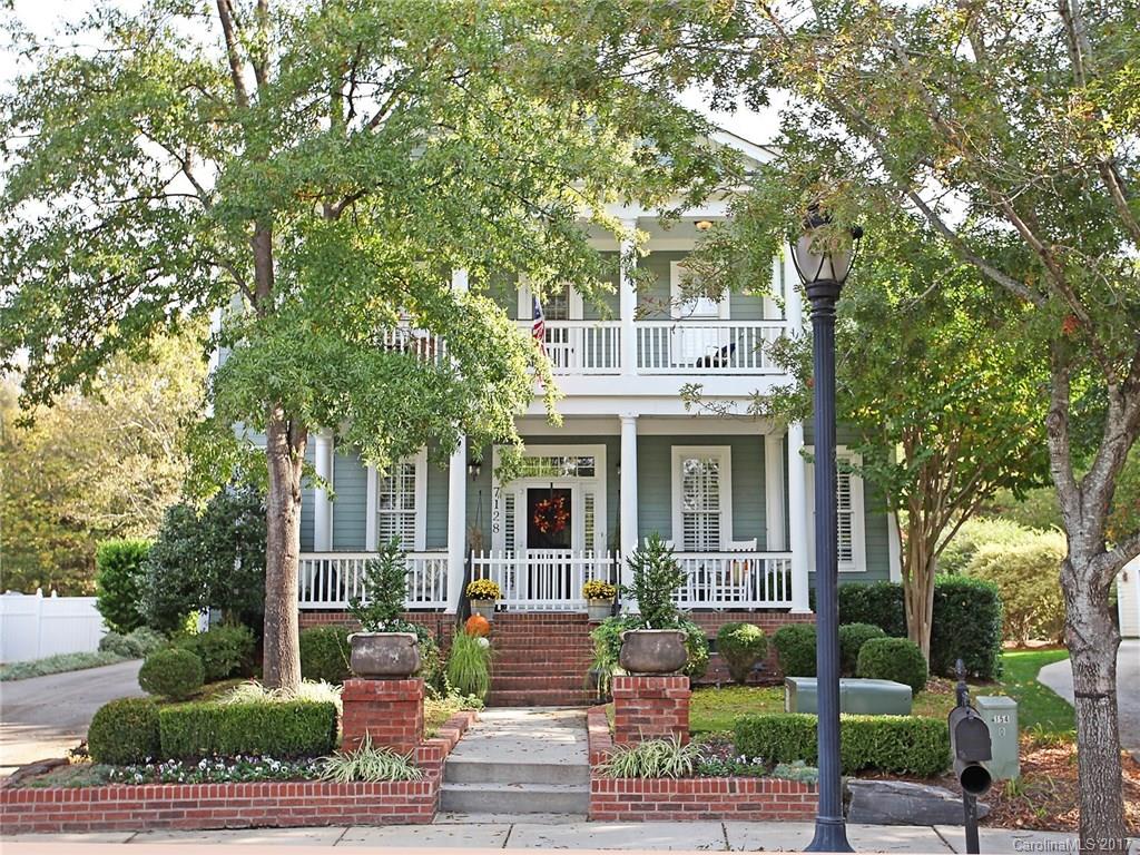Superior Quality & Style! Dble Front Porch w/gorgeous walkway! PRIVATE wooded back w/deck, arbor, fire pit on terraced patio w/spectacular prof. landscaping. WOW List: plantation shutters, wainscoting, curved staircase, built-ins, transom windows, see thru fp, custom mantle, wood beam accent, vaulted & tray ceilings, glass-faced & lighted cabinetry, butler's pantry, Lg Kit Island w/seating, storage. "4th BD converted to loft. Seller willing to convert back or give credit w/ acceptable offer."
