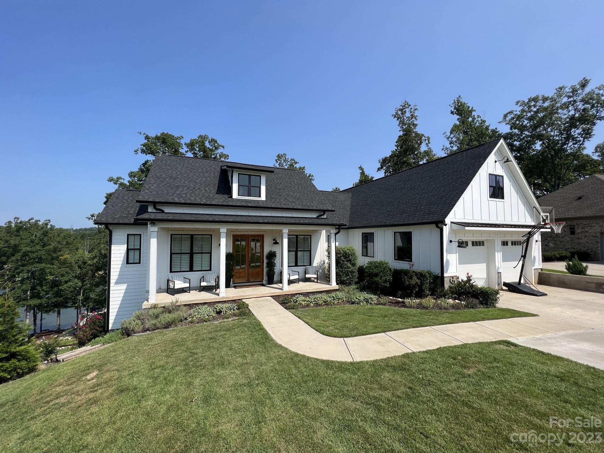 Beautiful Lake Front Modern Farmhouse!! 370 Calming Way, located in Fort Mill, South Carolina, is a stunning single-family waterfront home that was built in 2020. With a total of 5 Bedrooms, 4 bathrooms and 1 half bathroom, this property offers plenty of living space and is perfect for entertaining. The house boasts a spacious heated living area of 4,727 square feet with an additional 829 sq feet of garage and a mechanical room. Situated on a generous lot spanning .84 acres, this property offers a beautiful outdoor space on Lake Wylie with some of the best views on the lake. With its recent construction, this home showcases modern and updated features, ensuring a contemporary and stylish living experience. Whether you are looking for a primary residence or a vacation home, 370 Calming Way is an exceptional property that combines luxurious living, ample space, and a desirable location in Fort Mill, SC.