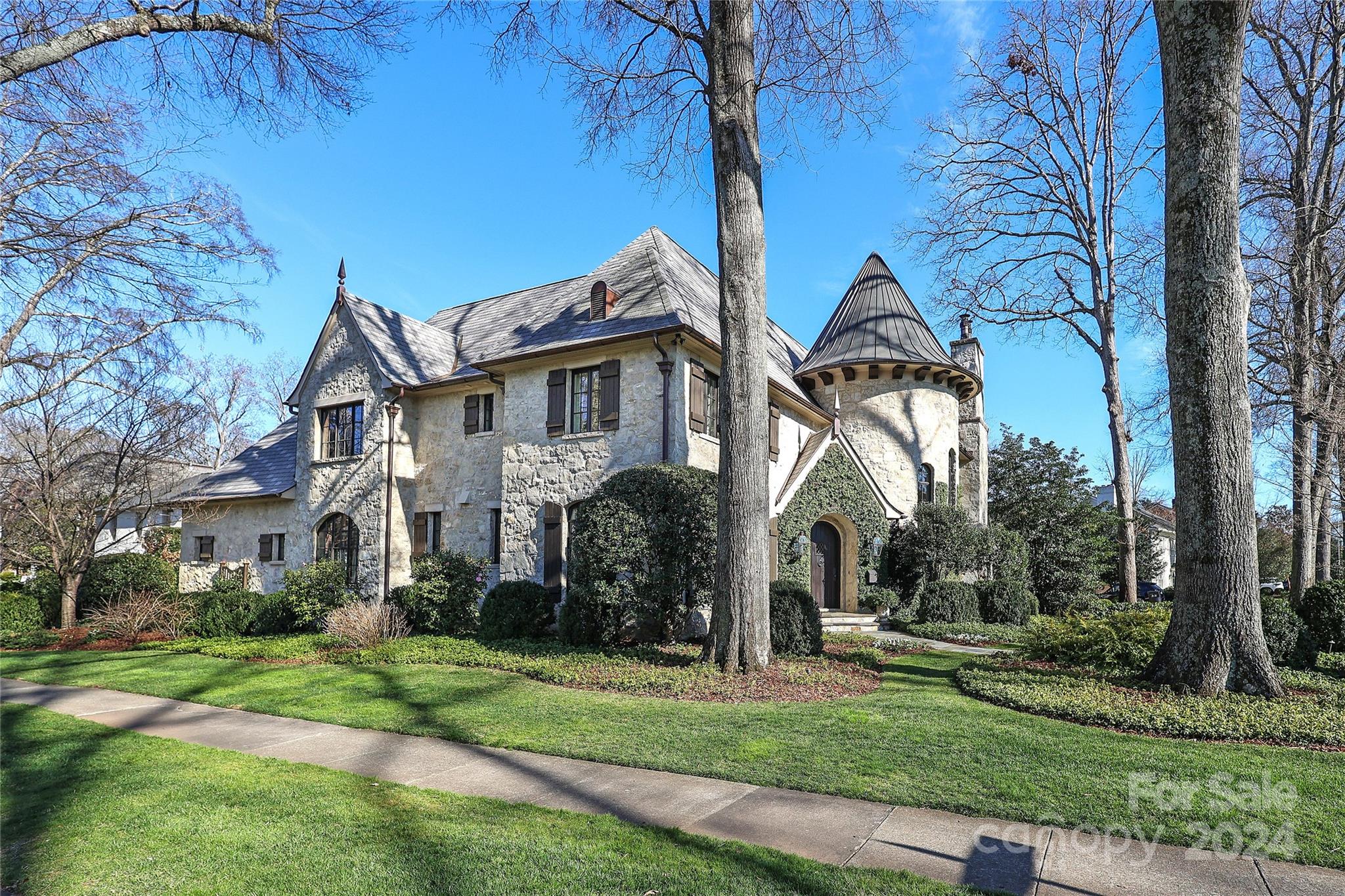 Sherwood Ave in Myers Park is one of the most sought after streets in Charlotte. This custom home was built in 2010 w/the utmost attention to detail & finishes. An open living area allows easy access from formal areas to the outdoor pool & entertaining area. The main level features a 750 bottle wine cellar, paneled study, alcove for a second office & a large primary suite. Upstairs are 4 additional secondary bedrooms each w/a private bathroom. Both bonus & rec rooms are comfortable lounging for movies &/or games to occur at the same time. The stone work both in & out is from the Old Crow Distillery circa 1835 located in Kentucky. The upstairs family room fireplace mantle is reclaimed wood from an old SC church & the powder room sink was carved from a large piece of marble & imported from Italy. The backyard is perfect for entertaining by the swimming pool, dining alfresco, or relaxing by the wood burning fireplace. Roof is synthetic slate & copper. This home will be a pleasure to see!