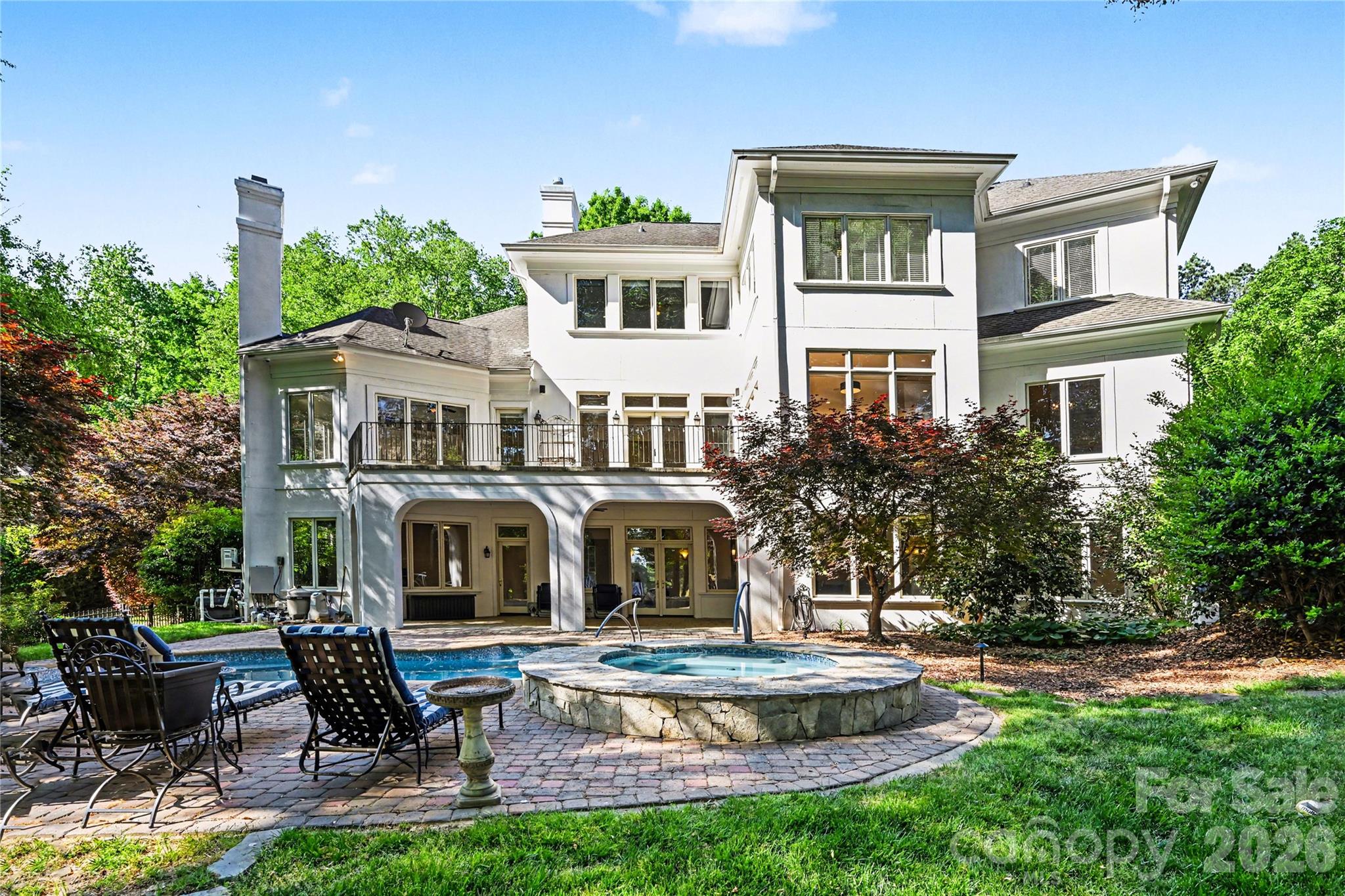Helms Custom Home overlooking the 14th green and salt water pool, waterfall, and spa. The backyard is fenced and has resort feel with covered veranda, pool deck, and golf course views. Professional night time lighting design in front and rear and state-of-the-art security, glass break, motion, cameras, and triple door locks.  2 primary suites with custom closets and large spa bathrooms.  Large east facing verandas (upper and lower) perfect for entertaining in the evenings without excessive heat in summer.  Windows Galore!!!  New exterior and interior paint 2026.  9ft custom interior doors throughout, exquisite trim, all bedrooms suites, and all closets professionally outfitted with custom finishes.  The kitchen has huge walk in pantry and expansion area in oversized breakfast room/area. This home was built for entertaining with extra large lower level bar, open floor plan, dance studio/gym, and 2nd primary suite. Bar area easily adapted to full kitchen if looking for additional living quarters.  Upstairs media room and homework/office loft area with built in desk, cabinetry, storage closet.