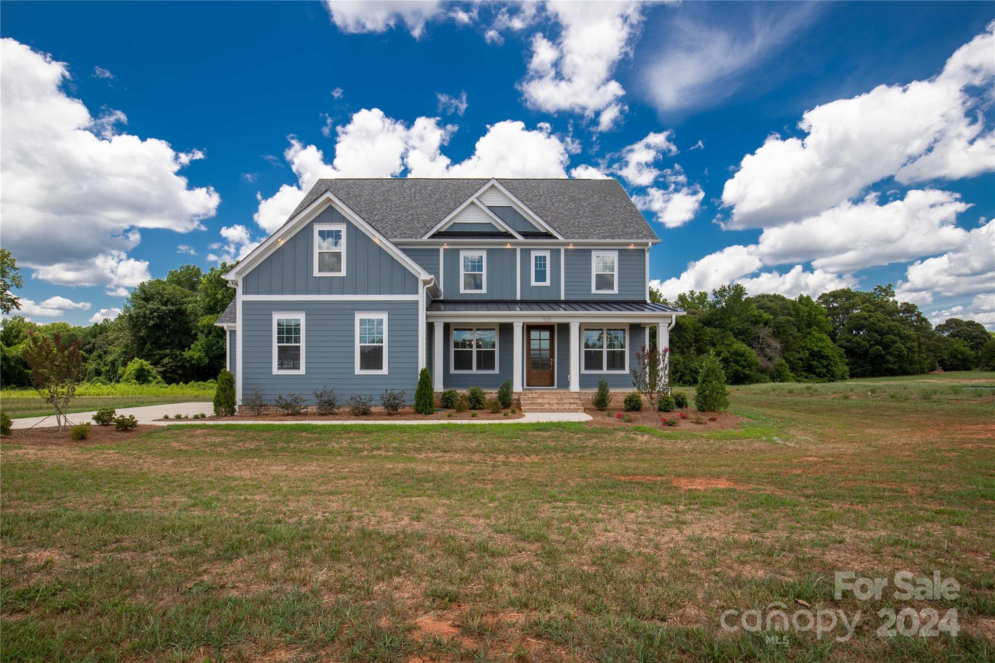 Recently completed beautiful modern farmhouse located in Edmunds Farm. This home offers 5 bedrooms, 4 bathrooms, and a spacious lot. The gourmet kitchen features an oversized tabletop island, making it perfect for entertaining. The family room includes a gas fireplace w/built-ins, creating an ideal space for relaxation and entertainment. The main floor has a study, dining area, mud room with a drop zone, and a guest room with a full bath. Upstairs, the luxurious primary suite boasts a trey ceiling, walk-in closet, double vanity, glass shower, & convenient access to the laundry. Additionally, there are 3 more bedrooms, 2 with en-suite baths, and a bonus room that completes the 2nd floor. This open-concept home showcases beautiful, trending finishes. You can enjoy outdoor living on the screened porch or visualize adding a pool in the expansive 1-acre yard. The side entry garage & carriage garage offers ample storage.