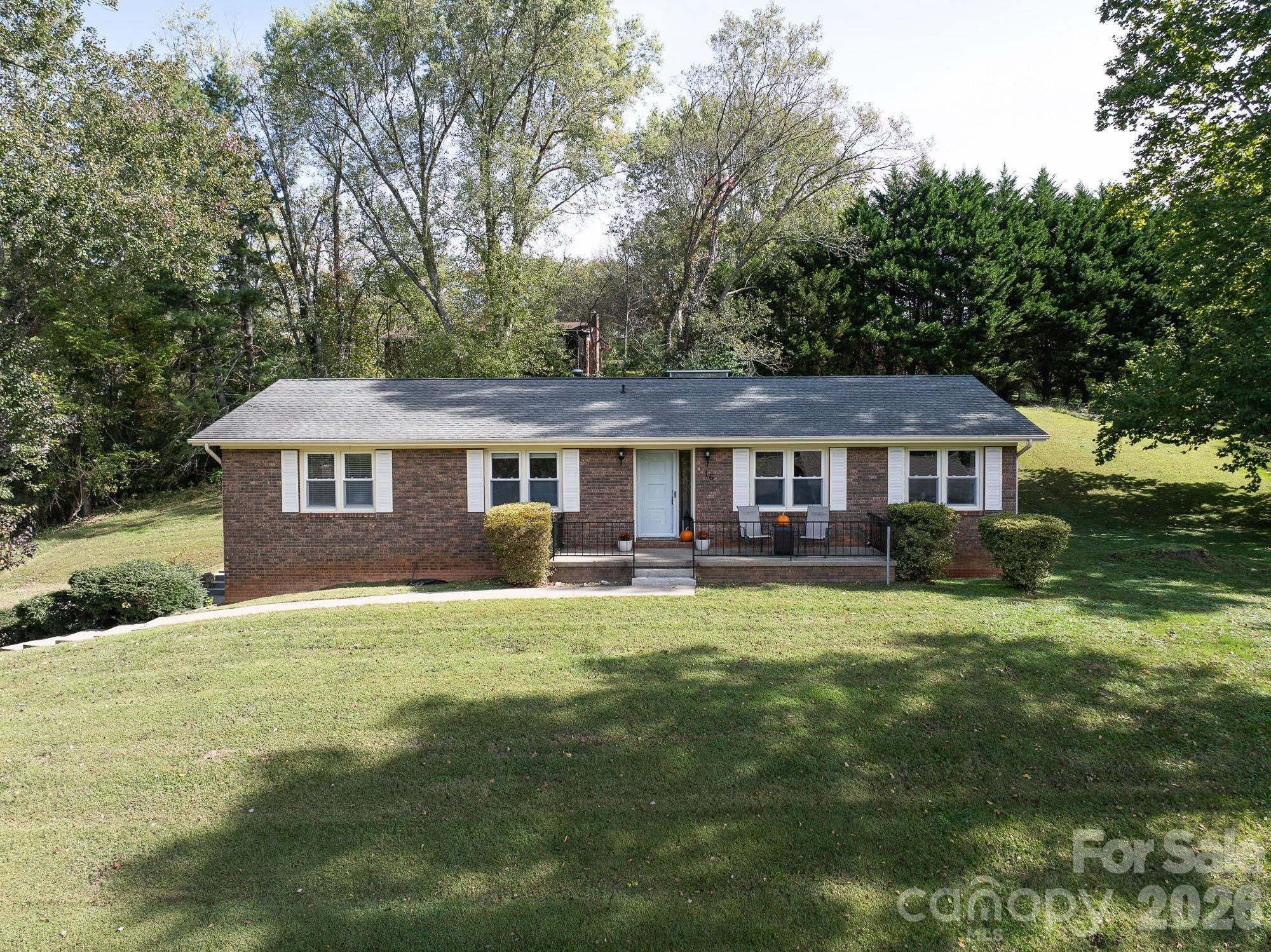 Price improvement - $440,000. 
Charming brick ranch located in the lovely Sunset Heights neighborhood. This home sits on a spacious .61 acre, featuring mature trees that provide excellent shade and privacy.

The interior offers an open layout connecting the living and dining rooms, with a kitchen that flows into a cozy den featuring a wood-burning fireplace. Three bedrooms and two full bathrooms are conveniently located down a short hallway. The primary bedroom has an en-suite bath.

The daylight basement provides significant additional living space, including a large, heated bonus room with a second wood-burning fireplace, a full bath, and a laundry area. This level offers great potential for a mother-in-law suite or a rental unit. Additionally, the property includes a sizable workshop and a side-entry two-car garage with plenty of room for lawn equipment.

Whether you are relaxing on the front porch or grilling on the back deck, this home offers a wonderful setting for both comfort and entertaining.

Key updates and features include:

- HVAC: Replaced in 2020
- Water Heater: New (2024)
- Chimney: New, sealed cap (2024)
- Roof: 20 years old
- Located 15-20 minutes from local grocery stores and restaurants