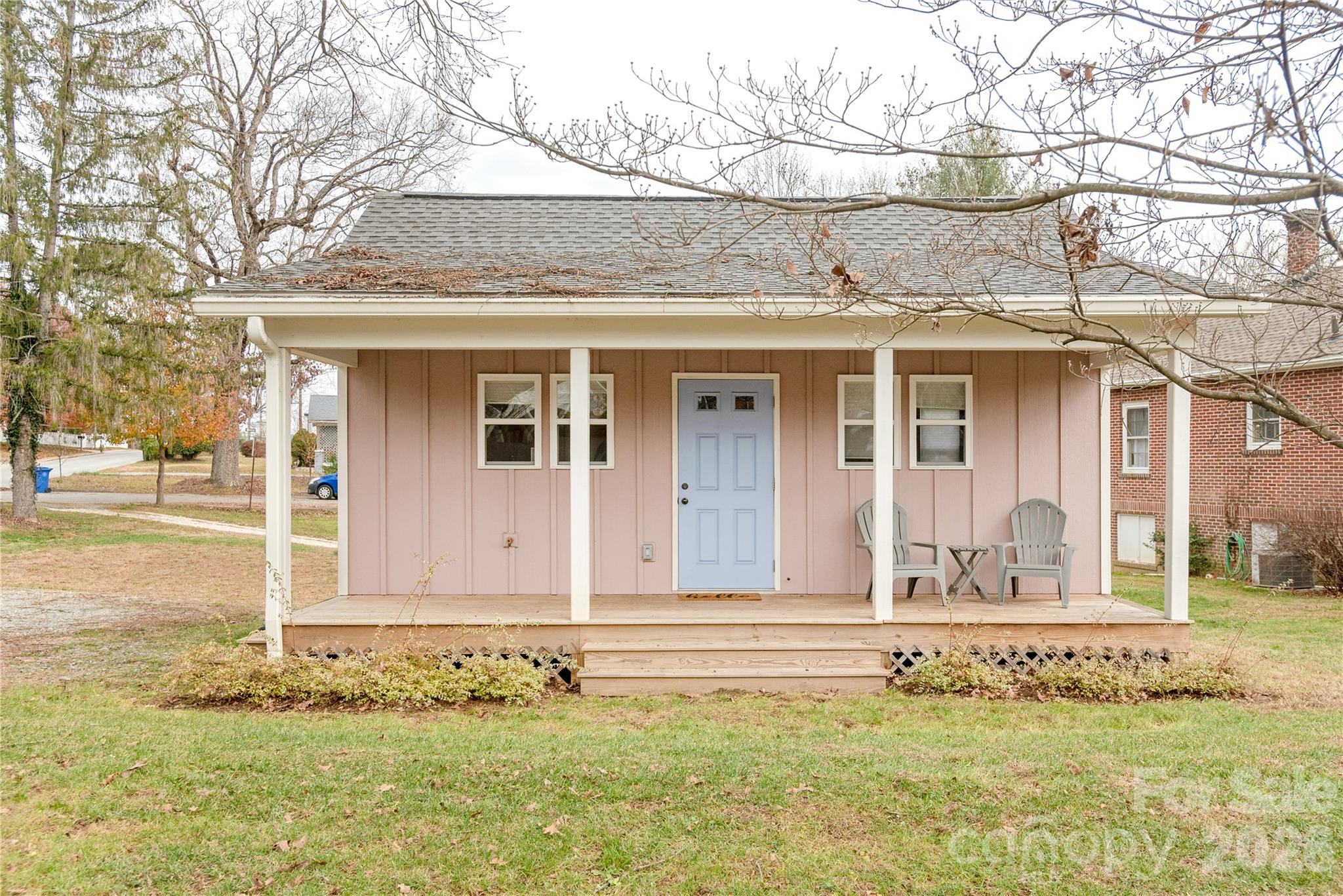 Welcome to your perfect Hendersonville retreat! This charming studio-style cottage offers the ideal blend of comfort, convenience, and investment potential—all within walking distance to vibrant downtown Hendersonville.

Thoughtfully designed, this fully furnished home features a cozy yet functional layout complete with a kitchenette equipped with stainless steel appliances, a dedicated workspace nook, and a comfortable living/sleeping area. Step outside onto the covered porch and enjoy peaceful city views, all framed by your own quaint white picket fence.

Whether you're looking for a personal getaway or an income-producing property, this home delivers. With a strong rental history and approximately $21,000 in rental income in 2025, it’s a turnkey opportunity ready to go.

Just minutes from the charm of Main Street—featuring local dining, boutique shopping, and live music—and a short drive to the Blue Ridge Parkway and Pisgah National Forest for hiking, waterfalls, and outdoor adventure.

A rare opportunity to own an affordable slice of the mountains with built-in income potential!