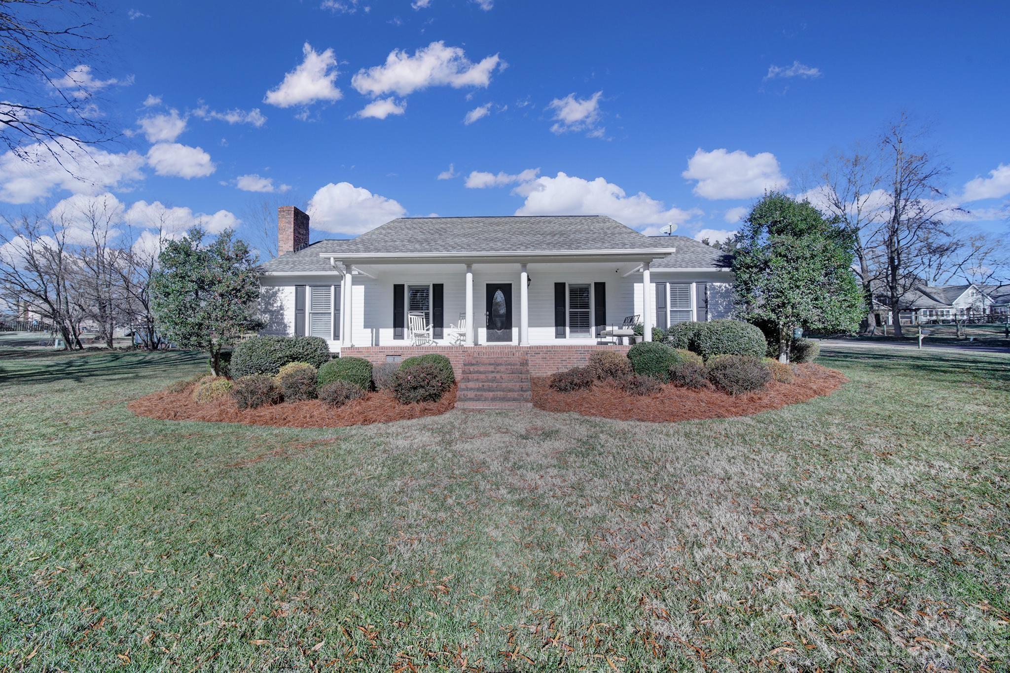 Come see this Beautiful 4BD/2.5BA home located in the highly desirable Hillcrest neighborhood of York. This home sits on a level 1/2 Acre lot overlooking a well maintained fescue lawn with irrigation. The main floor offers hardwood flooring, stone fireplace in the living area and a spacious kitchen has granite countertops, and stainless steel appliances. Primary bedroom has a custom bathroom with dual shower heads and vanities. Upstairs you will find a bedroom/loft area perfect for entertaining or playing games. Relax on the covered rocking chair front porch. 2 Car extended garage. Located close to dining, shopping, airport and downtown Charlotte. Schedule a showing today!
The lot next to the home is also for sale - Parcel ID 070-02-06-006 45k .31 Acres