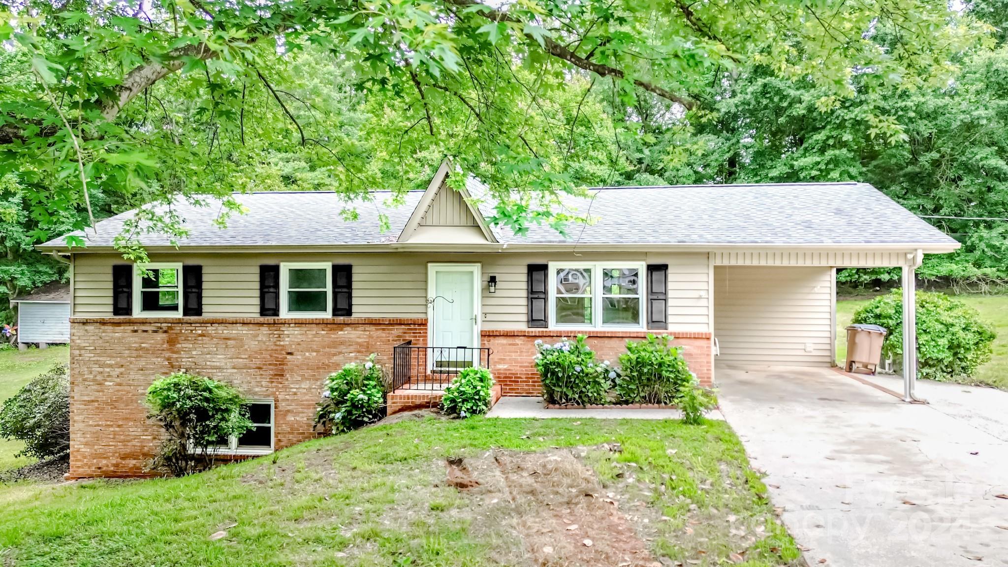 Welcome home! The entire home has been freshly painted, offering a clean and modern aesthetic. All new LVP flooring through out. This home features 4 spacious bedrooms, providing plenty of room for family and guests. 2.5 bathrooms, all featuring brand-new vanities for a fresh look.  Cozy up by the brick fireplace in the family room. The lower level boasts built-ins for storage and an additional family room with walk-out egress, perfect for entertaining or a home office. Schedule a viewing today and experience the perfect combination of comfort and style.