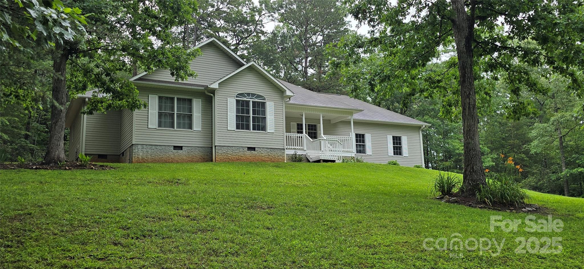 Hemlock Crossing in Mill Spring, Come quickly to see this BEAUTIFUL balanced 3B/2B Home w/2 car garage right off the kitchen then into the main living area w/soaring ceilings w/many extras on a Tranquil Private setting, located just 5.5 miles from Lake Lure & Ingres Grocery w/ Lake Adger having FREE Public access ramps for your Boat being ONLY 5 mins. away!! Only 14 mins. from Tryon Equestrian Center and 35 mins. to Asheville. Enjoy country living while still being close to Wineries, Shops, Restaurants & Great local Mill Spring schools!! Nestled on 1.24 towering acres, so relax, unwind on the inviting Front Patio or on your even more private back deck overlooking all of your many Deciduous Hardwoods of White Oaks, Red Oaks, Hickory, Maples, Poplars and more!! Perfect forever or part-time home or STR! This home is literally a Diamond among gems, offering both modern comfort, charm & privacy! Now new ability to have super fast Spectrum Internet Service!!!
VERY MOTIVATED SELLER offering buyer $10,000 in concessions at closing!