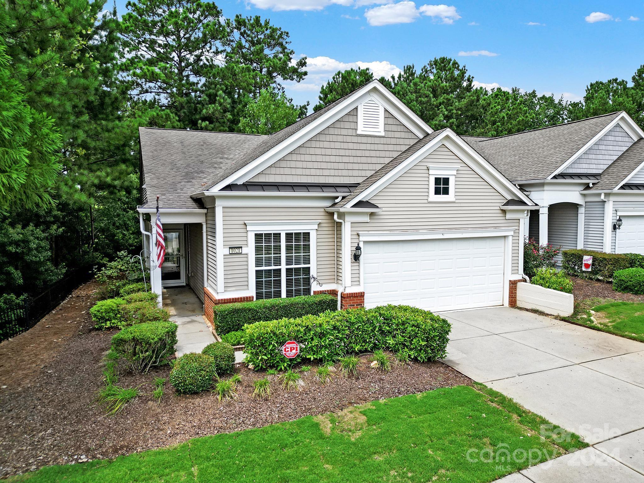 Move-in ready Villa with 2-car garage in sought-after 55+ Sun City Carolina Lakes! Private END unit, FRESHLY painted throughout with NEW LVP flooring in main living areas & NEW carpet in bedrooms. A separate study sits just off the foyer, ideal for a home office or craft space. Natural light streams into the living room with breakfast bar overlooking the kitchen featuring electric range, black appliances, solid surface countertops, recessed lighting, & eat-in dining area. Refrigerator & washer/dryer included. The primary suite sits at the back of the home with double doors opening to the private ensuite bath, dual sink vanity, walk-in shower, & spacious walk-in closet. Just down the hall is the guest bedroom, hall bath & laundry room. Enjoy the summer breeze on the screened porch with ceiling fan or soak up the sun on the back deck overlooking shade trees for additional privacy. Enjoy resort-style amenities, social clubs, and minutes to grocery, restaurants, shops, medical & more!