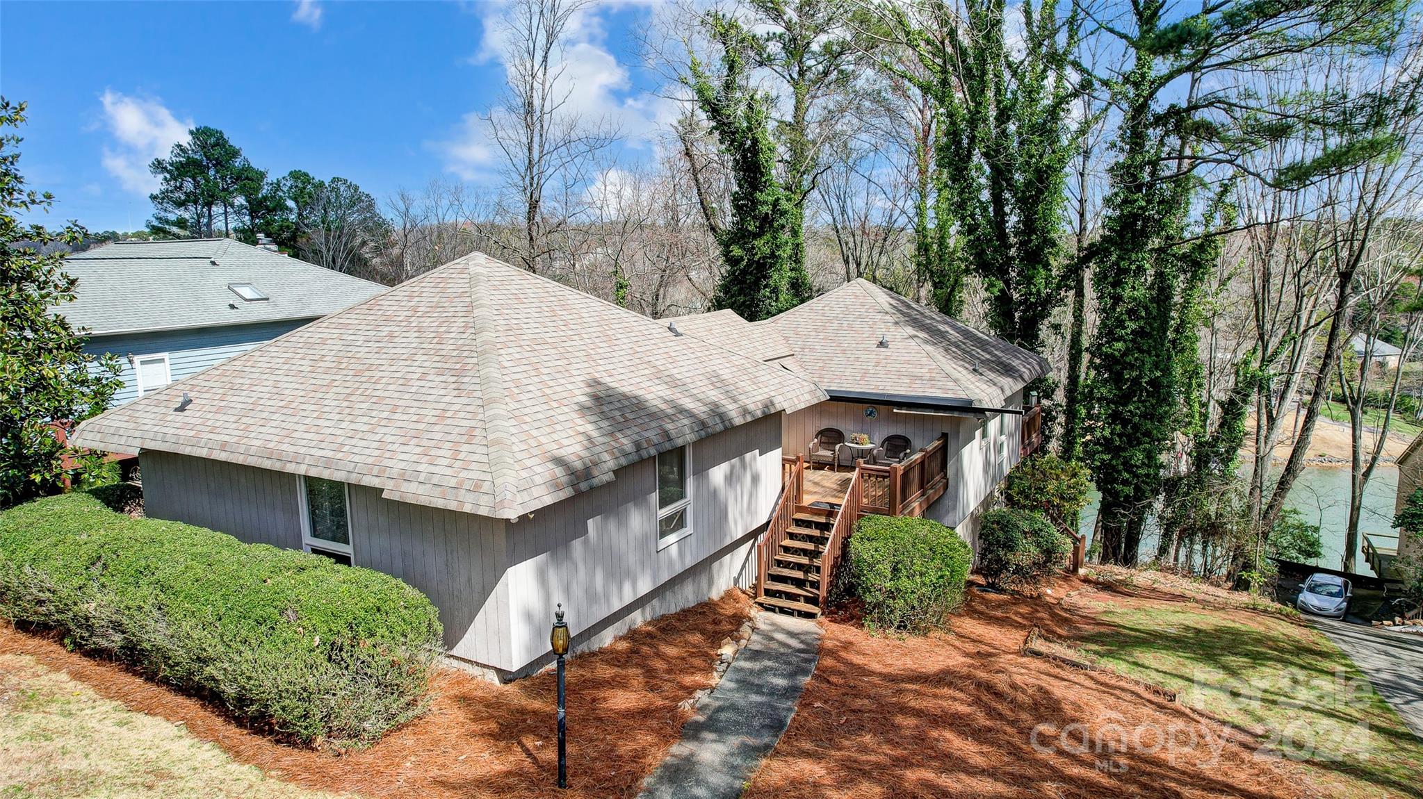 Unlock the potential for your ideal lakeside living with this unique opportunity. Spanning approximately a half acre across two parcels, this property is situated in the sought-after Tega Cay Peninsula. The existing 3-bedroom home exudes a charming cottage atmosphere, awaiting your personal touch. A dock permit is approved, offering the promise of waterfront enjoyment. Bring your vision to life and embrace the vacation lifestyle Tega Cay has to offer, including access to the lake, golf course, marina, walking trails, parks, sports programs, concerts, festivals, pickle ball, tennis and more. Zoned to the award-winning Fort Mill Schools, this property presents endless possibilities for creating your dream lake retreat.
Listing also includes 2005 Marquesas Ave - Parcel ID 641-02-01-005