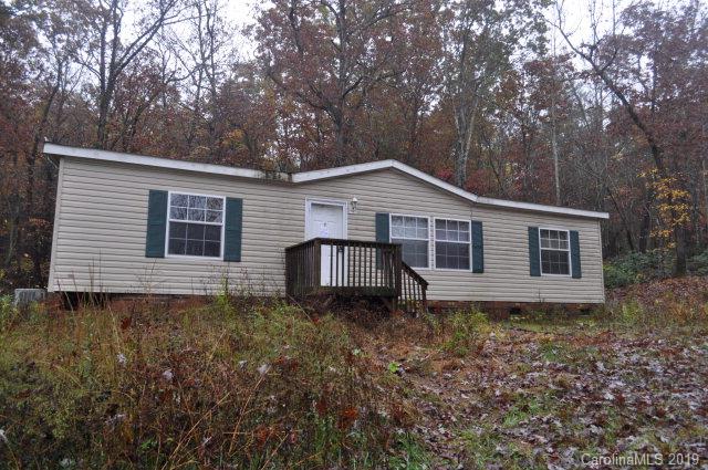 This 2010 doublewide offers a nice open living area with Kitchen, Dining and Living Room on approx. 0.82 acres.  House offers split bedroom plan with Master Bedroom, Bath and walk in closet on one end and two addl Bedrooms and 1 Bath on opposite end. Open Kitchen with pantry offers plenty of storage space and cabinets. Property is private and back property line adjoins US Forest Service land. Property being sold AS IS, WHERE IS. Several repairs needed are being assessed. Priced below appraisal.