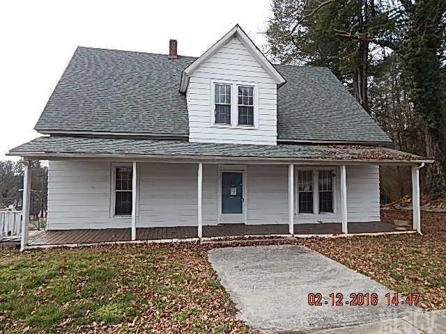 Large 3 br 2 ba home conveniently located near downtown. Home features large kitchen, dining room, foyer, den, stairwell, hardwood floors throughout and ceramic tile bathrooms. Den could be turned into additional bedroom. Home is in need of updates and some repairs. Missing heat pump but has oil furnace. Home also will need roof and ceiling repairs. Seller and or its agent make no representation to condition of property expressed and or implied. Sold as is.