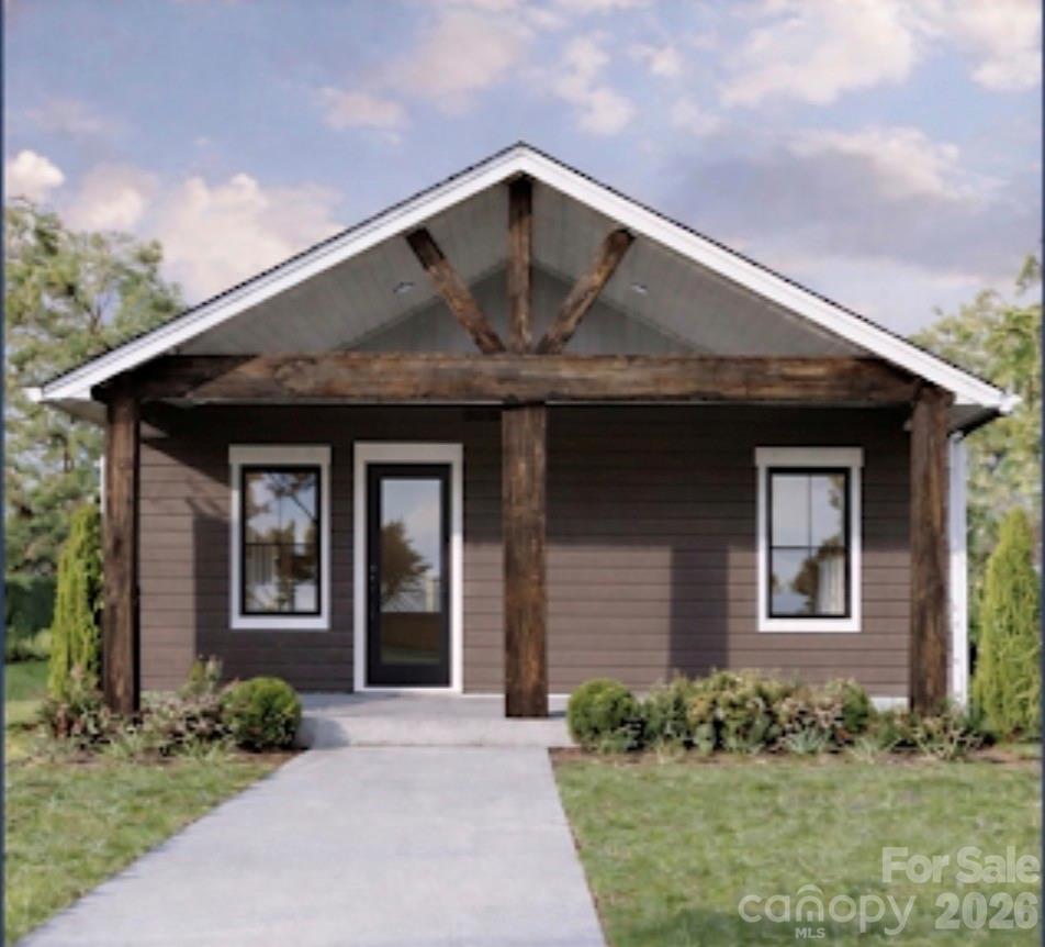 Construction to be completed by end of July. Experience modern luxury in this stunning new farmhouse-style ranch. Thoughtfully designed with high-end finishes, this home showcases craftsman soft-close cabinetry, elegant quartz countertops and subway tile backsplash, LED recessed lighting, and ceiling fans with remotes. LVP flooring flows seamlessly throughout, offering both style and durability. Set on a spacious, private wooded lot, this residence provides a serene retreat away from busy traffic—paired with the benefit of low taxes.