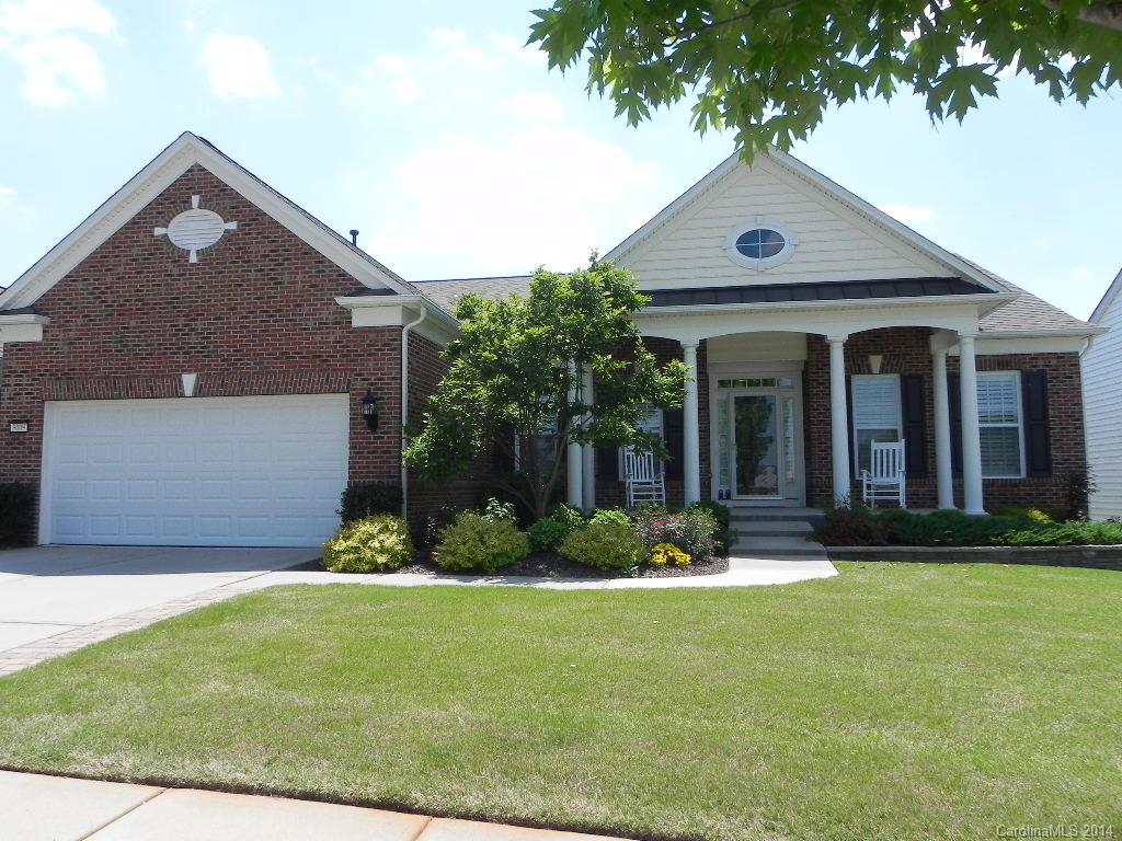 Beautiful Bluffton Cottage 3BR/3BA w/office, sunroom & full finished basement. It features gourmet kitchen, cherry wood cabinets, granite counters, gas stove, compactor, under/over counter lighting, roller shelves. American cherry hardwood floors, crown molding, plantation shutters/silhouettes, ceiling fans & more. See the expanded deck, irrigation, auto-awning & view.