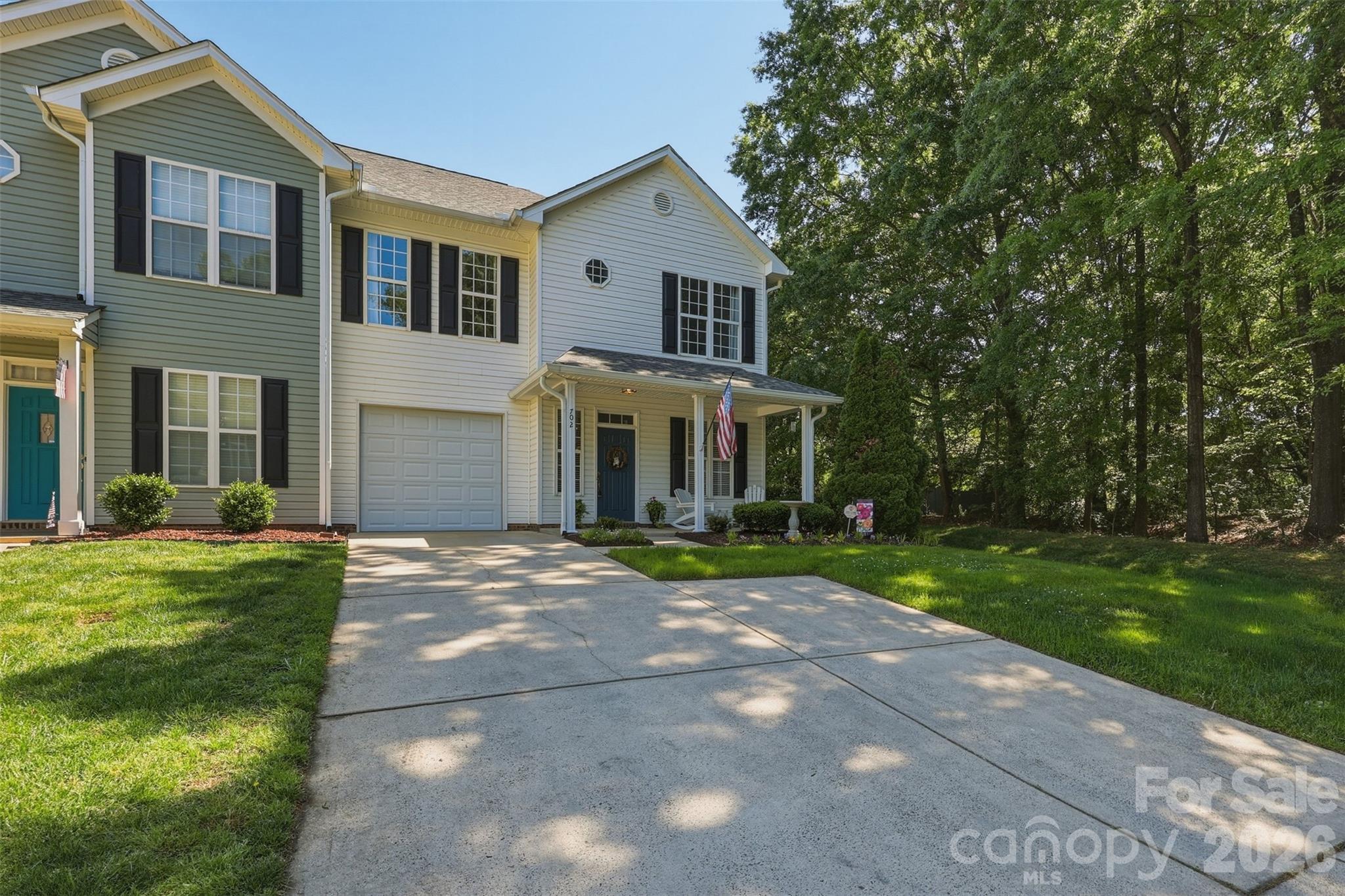 Enjoy low-maintenance living just minutes from Charlotte—without Charlotte taxes—and access to top-rated Fort Mill schools. Located in the quiet Glen Ridge Townhomes section of the Regent Park neighborhood, this beautifully maintained 3-bedroom, 2.5-bath end-unit townhome offers a bright, open floor plan perfect for everyday living and entertaining. The stylish kitchen features elegant quartz countertops and under-cabinet lighting that adds both warmth and functionality, creating a bright and inviting space for cooking and entertaining.

The main level showcases newer LVP flooring, along with custom crown molding and trim that add charm and sophistication throughout the living spaces. Upstairs, the spacious primary suite offers a private retreat with double vanities, a garden tub, and a walk-in tile shower. Two additional generously sized bedrooms, a full bath, and convenient upstairs laundry complete the second floor.

As an end unit, this home offers extra privacy, abundant natural light, and a charming outdoor space featuring three organic blueberry bushes. A guest half bath on the main level and a 1-car garage add everyday convenience.

Residents of Regent Park enjoy outstanding amenities including a community pool, tennis and pickleball courts, playground, and miles of scenic walking trails. Ideally located near shopping, dining, Uptown Charlotte, and Charlotte Douglas International Airport, this move-in-ready home offers the perfect blend of comfort, convenience, and value.